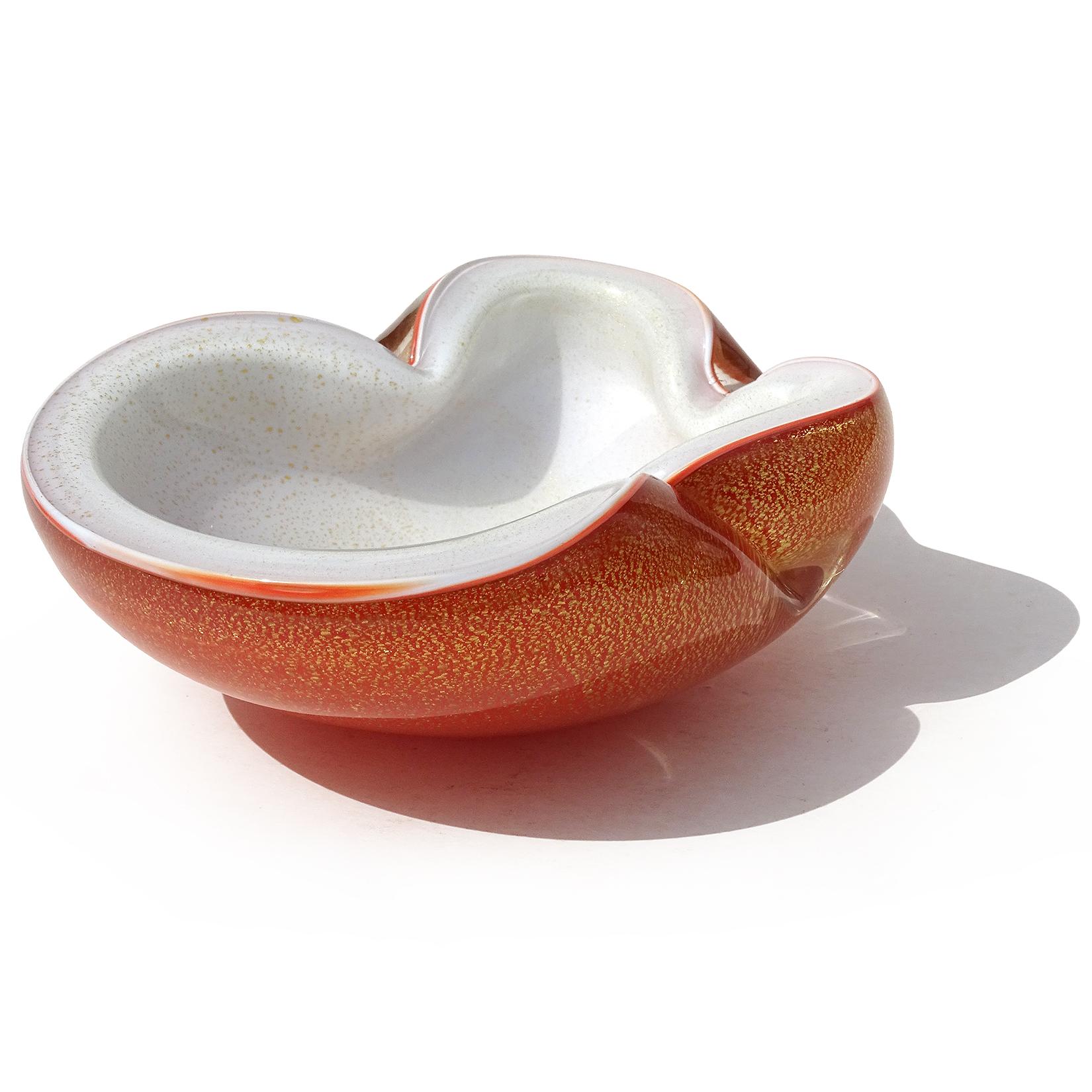 Beautiful vintage Murano hand blown orange over white, and gold flecks Italian art glass decorative bowl / ashtray. Documented to Master glass artist and designer Alfredo Barbini, circa 1950-1960. Published design. The color is a rich 