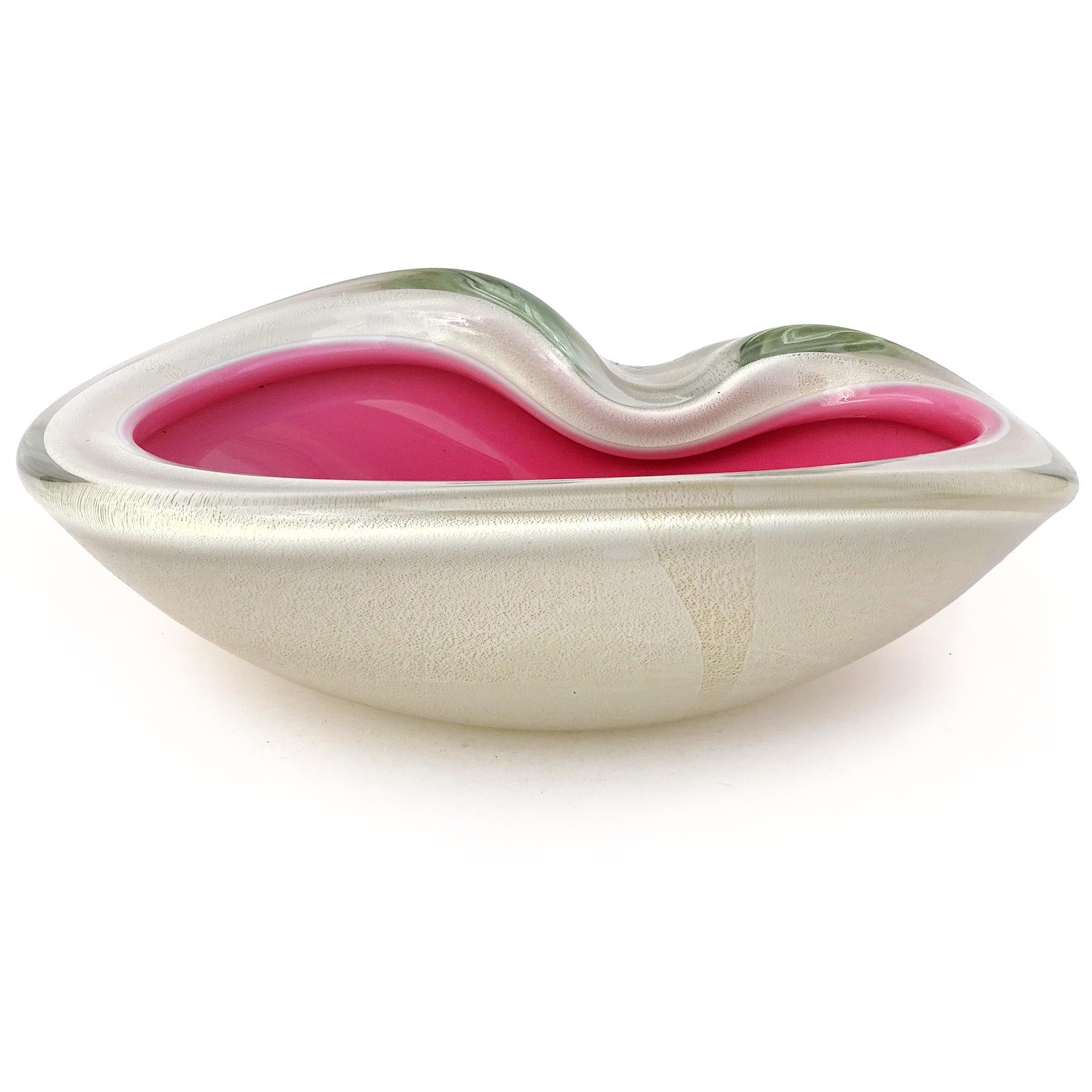 Beautiful vintage Murano hand blown pink and gold flecks over white Italian art glass decorative bowl. Attributed to designer Alfredo Barbini, circa 1950-60s. It has a thick folded over rim with biomorphic shape, and indent on the side that acts as