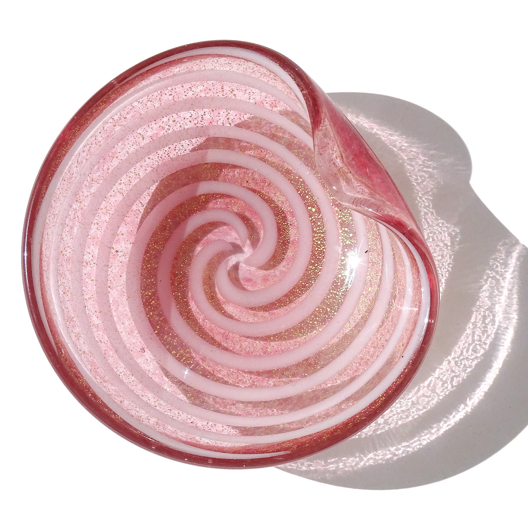 Beautiful vintage Murano hand blown pink, white and gold flecks Italian art glass bowl, vide-poche. Documented to designer Alfredo Barbini. The color is made with little dots of pink color. It has a white swirl design, and is filled with gold leaf