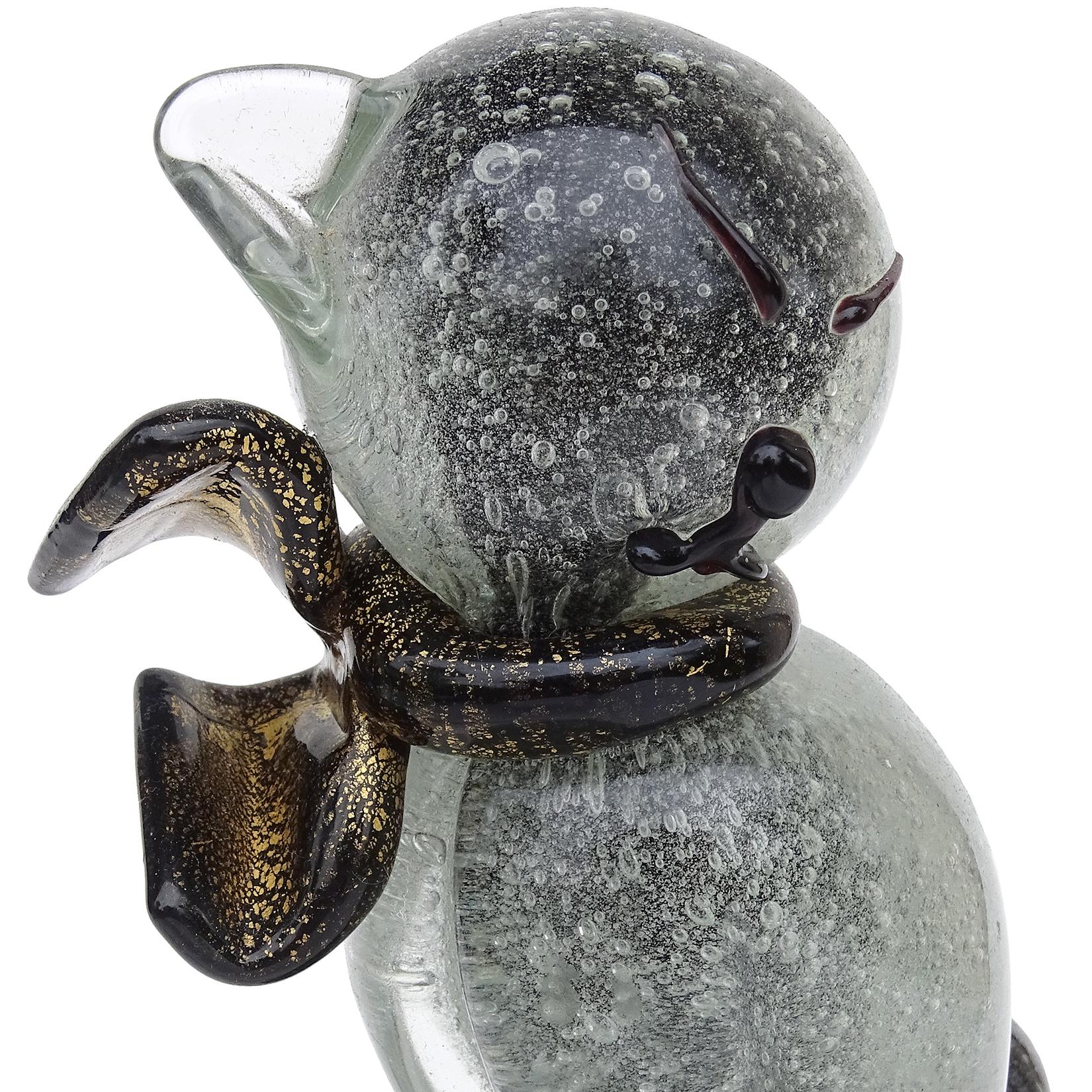 Beautiful vintage Murano hand blown Pulegoso bubbles, over black core and gold flecks Italian art glass cat sculpture. Documented to designer Alfredo Barbini, circa 1950s. The cat stands on a round base. The figure has an elegant shape, with black
