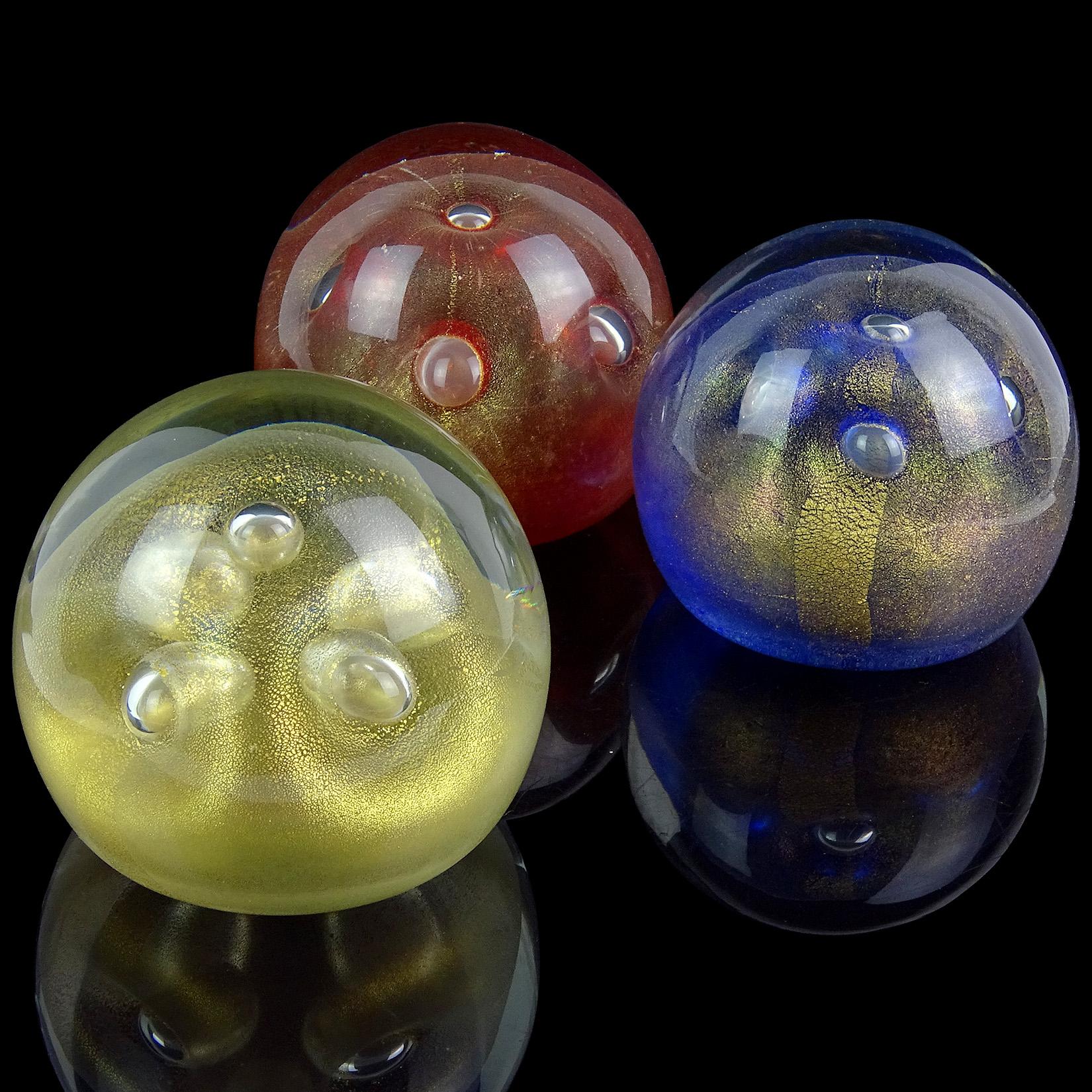 Priced Per Item (3 different colors available). 
Beautiful vintage Murano hand blown red, blue and gold Italian art glass paperweights with bubble decoration. Documented to designer Alfredo Barbini. I have previously owned several with the 