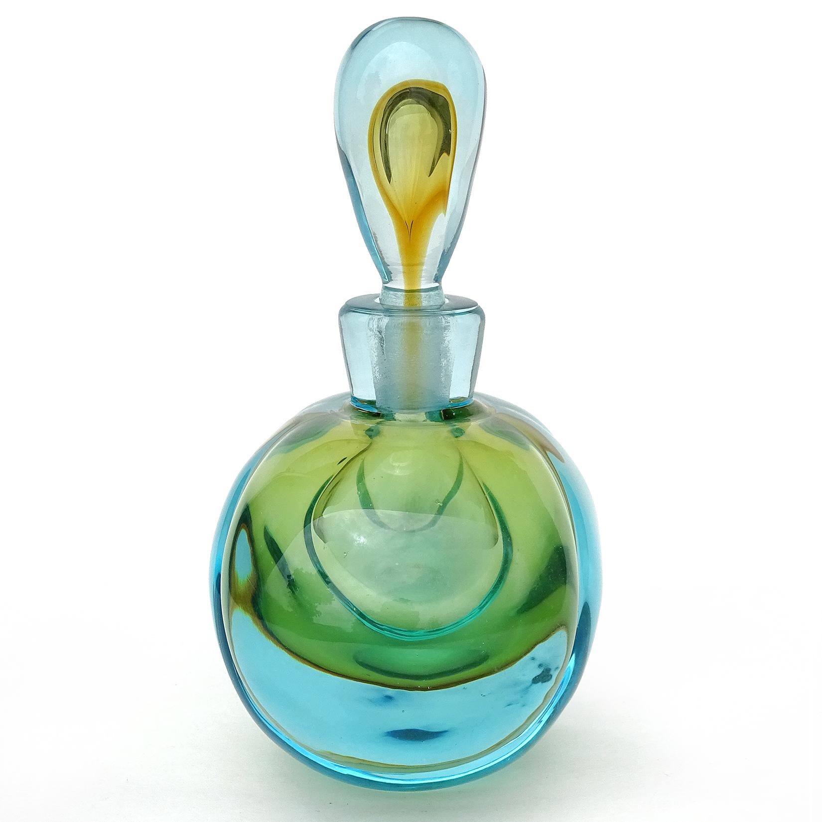 Beautiful large vintage Murano handblown Sommerso aqua blue over orange Italian art glass perfume bottle. Documented to master glass artist and designer Alfredo Barbini. Published in his catalog. The bottle has a large bulbous shape. It is made of