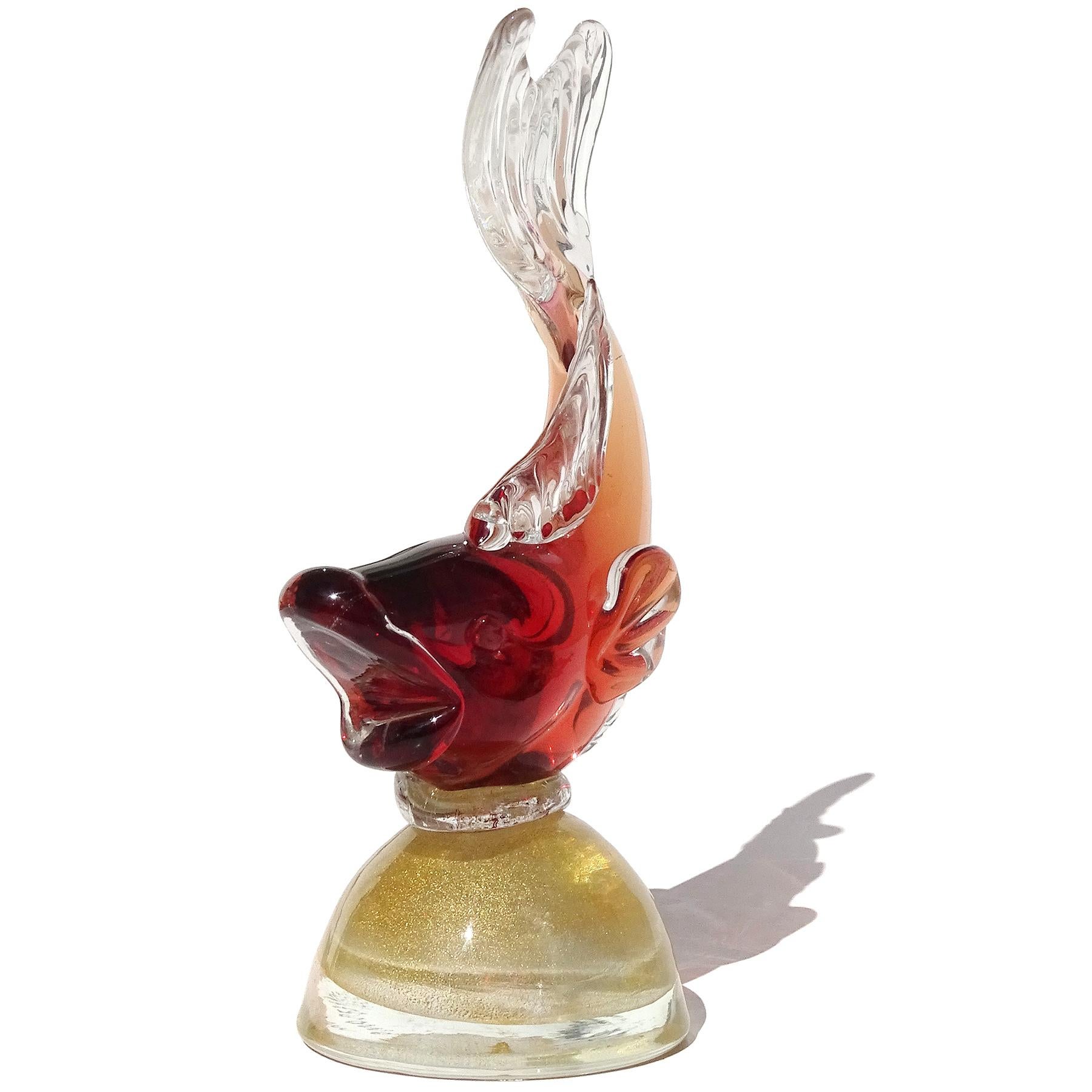 Beautiful vintage Murano hand blown Sommerso red and gold flecks Italian art glass fish sculpture on pedestal. Documented to Master glass artist and designer Alfredo Barbini, circa 1950-60s. The piece is actually signed underneath 