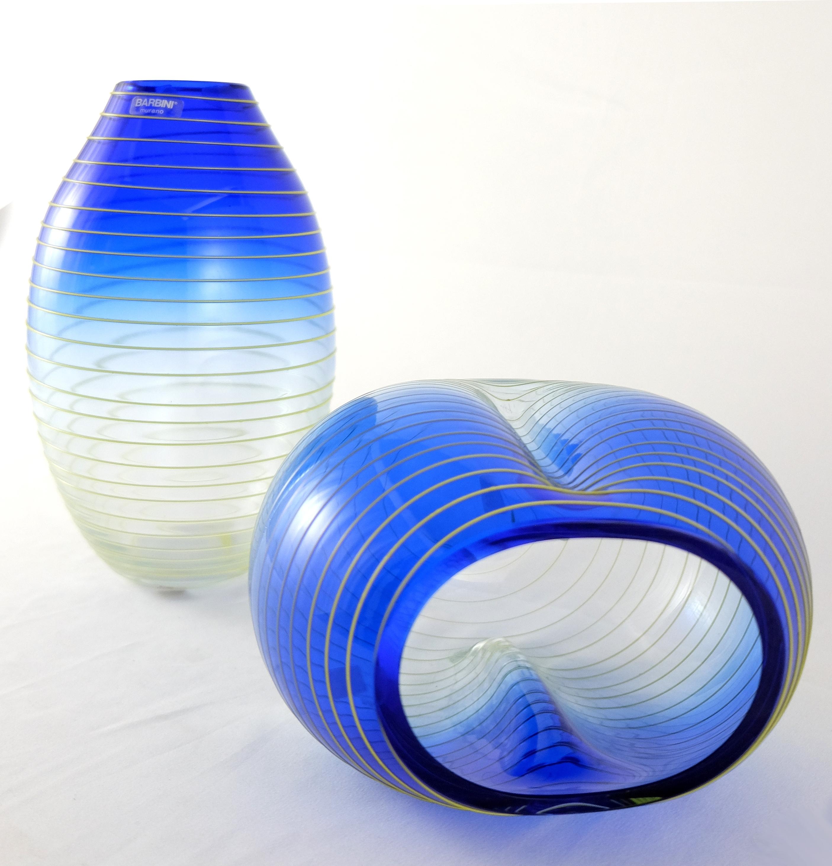 Barbini Murano yellow and blue stripe glass vase set from Italy. Offered for sale is a set of two yellow and blue stripe Murano glass vases. Each vase is signed on the base and still retains the original Barbini label. The measurements given below