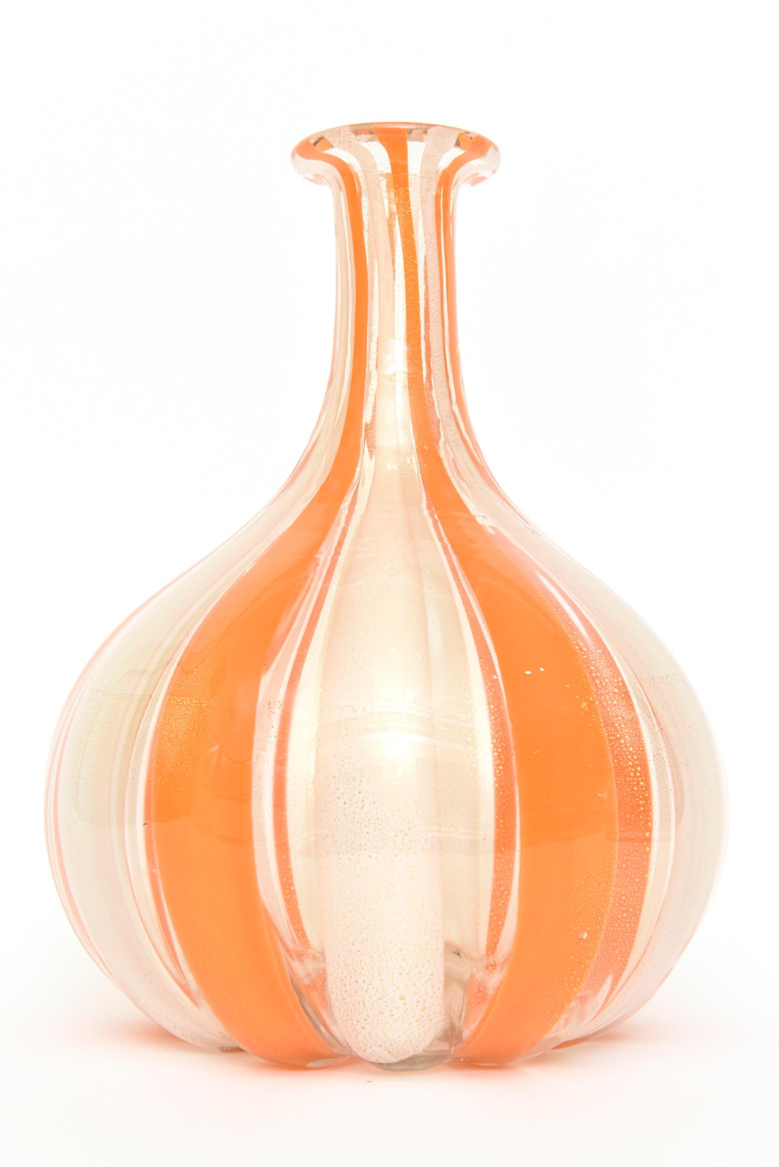 This very heavy and very fabulous bulbous Italian murano Mid-Century Modern striped orange, white and interspersed gold aventurine vase, vessel or bottle is the work of Alfredo Barbini. The original sticker came off in the washing of it to get it