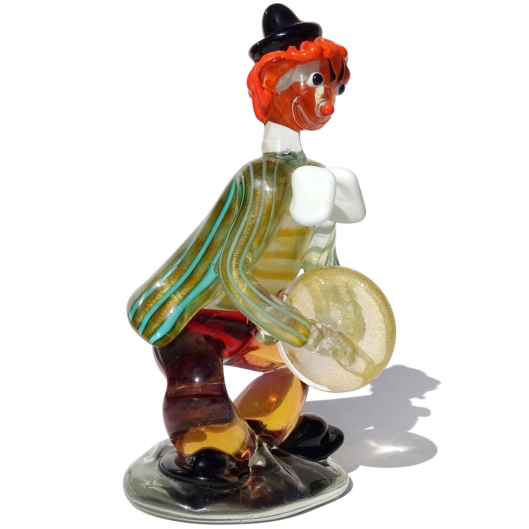 Beautiful and large, cute vintage Murano hand blown gold flecks Italian art glass musician clown playing the cymbals sculpture. Documented to designer Alfredo Barbini, for the Salviati company. The figure has a black hat, orange hair, large white