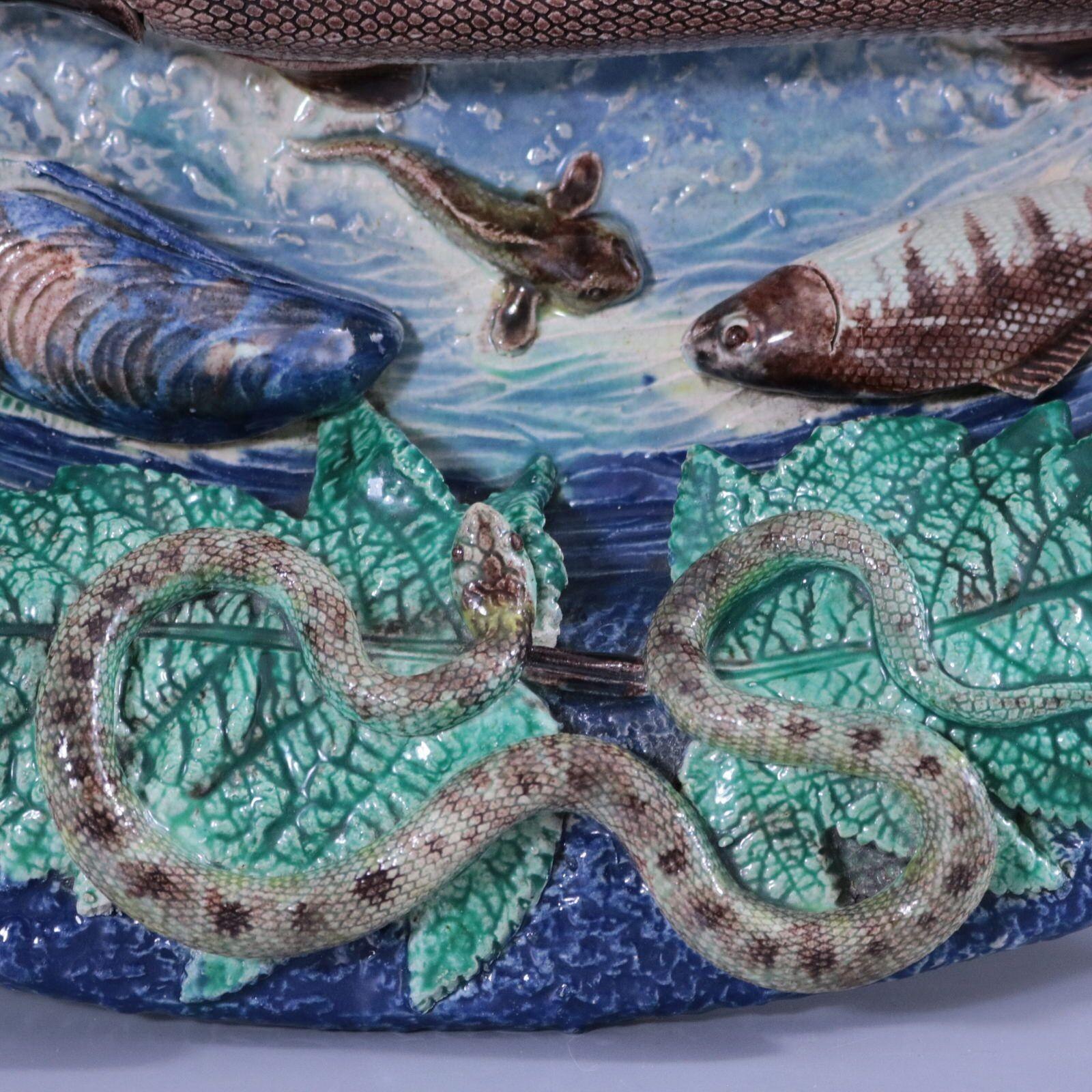 Barbizet (attributed) French Palissy Majolica wall platter which features fish (including a pike), a snake, a lizard, a frog, insects, shellfish and leaves. Colouration: blue, green, brown, are predominant.