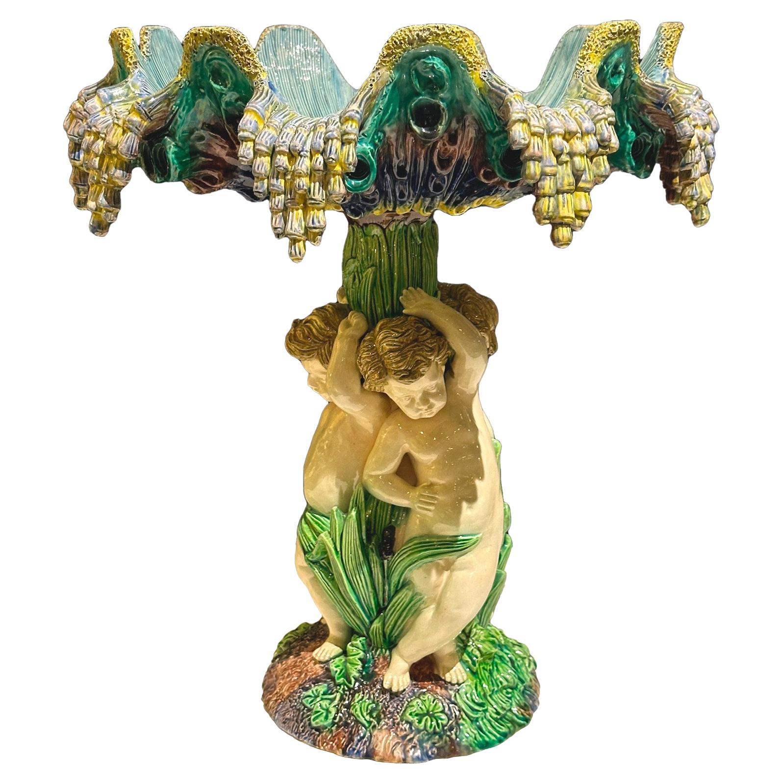 Barbotine centerpiece with putti and conch-shaped basin, 19th, french work