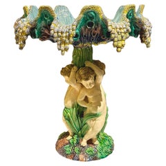 Barbotine centerpiece with putti and conch-shaped basin, 19th, french work