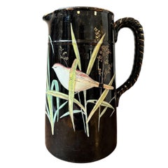 “Barbotine” earthenware pitcher with Japanese-style decoration – France, circa 1