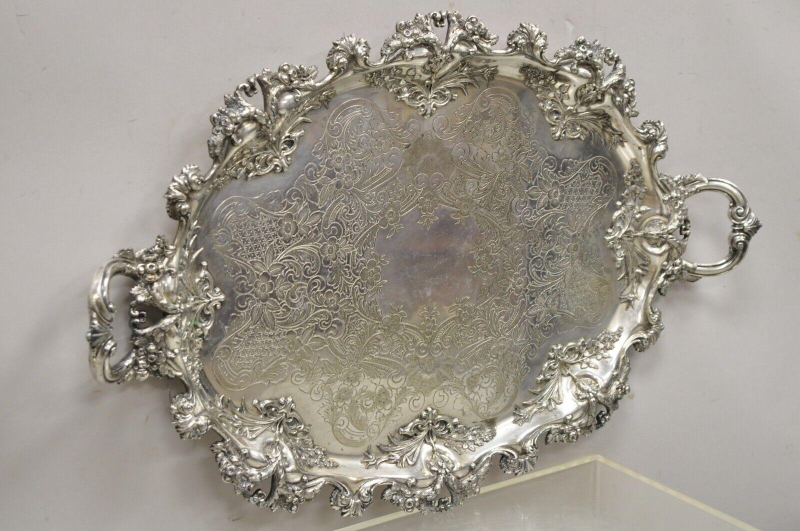 Barbour Co BSCEP antique Victorian ornate silver plate repousse oval platter tray. Item features extremely ornate leafy scrollwork, fine repousse work, raised twin handles, etched scrollwork to center, multiple marks to underside including 