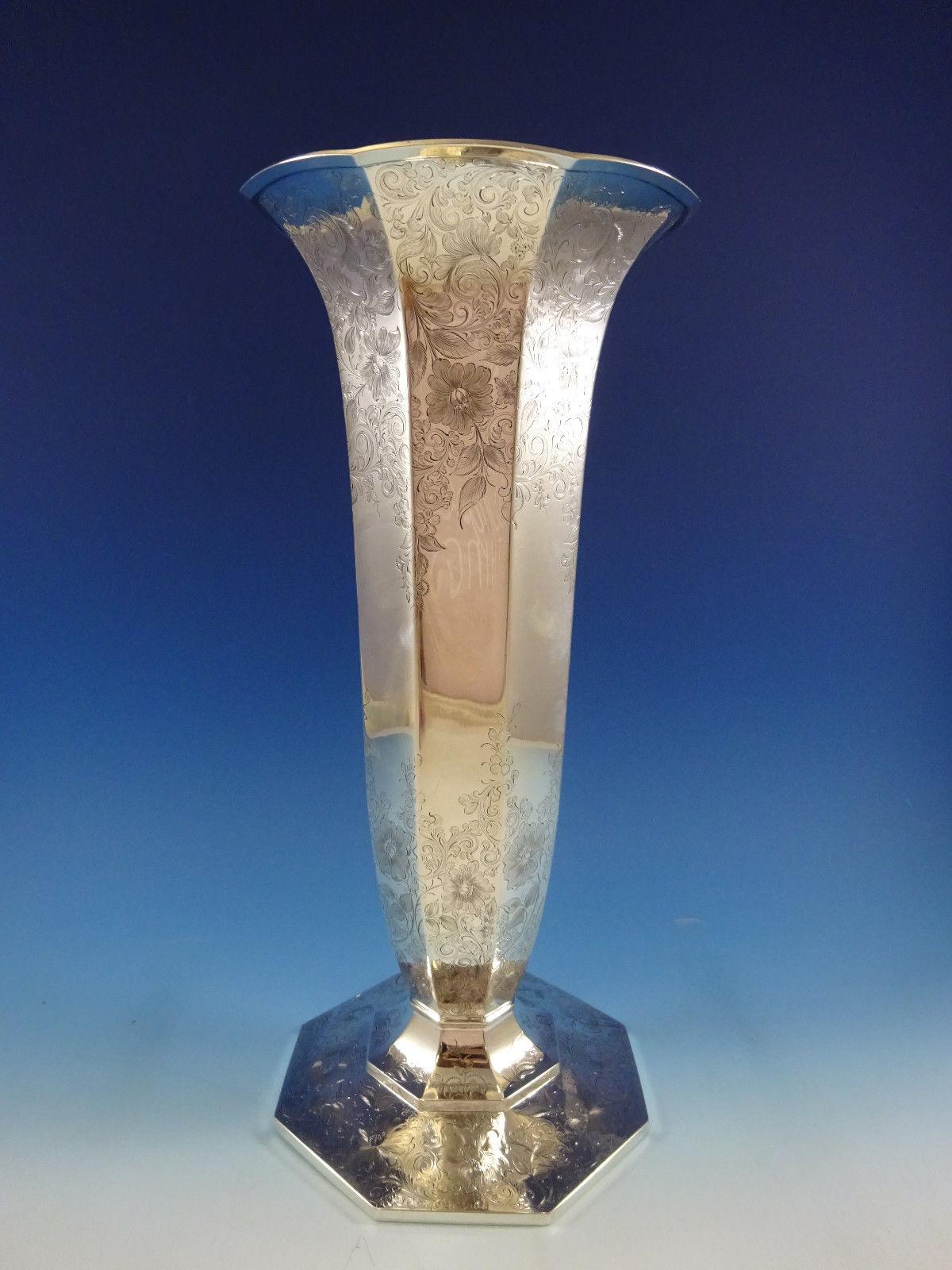 
Barbour Co

Beautiful Barbour Co monumental sterling silver Trumpet vase with beautiful bright-cut and engraved floral motifs. It is marked with #2033, and it measures an impressive 18 inches in height and 8 in diameter. Retailed by Bailey, Banks,