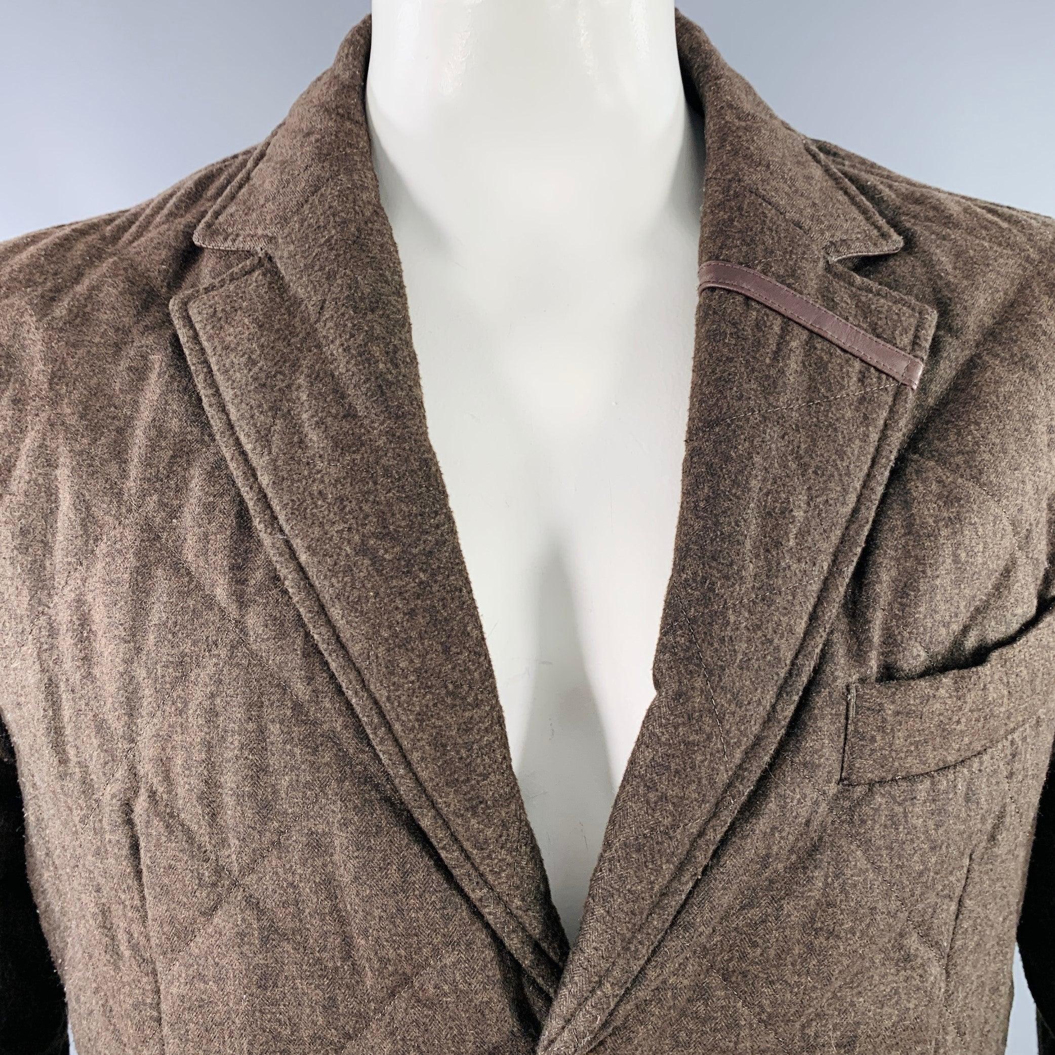 BARBOUR jacket
in a browne and olive polyester featuring a quilted style, notch lapel with leather stripe detail, and button closure. Made in the UK.Good Pre-Owned Condition. Moderate pilling on sleeves and sides. 

Marked:   L 

Measurements: 
