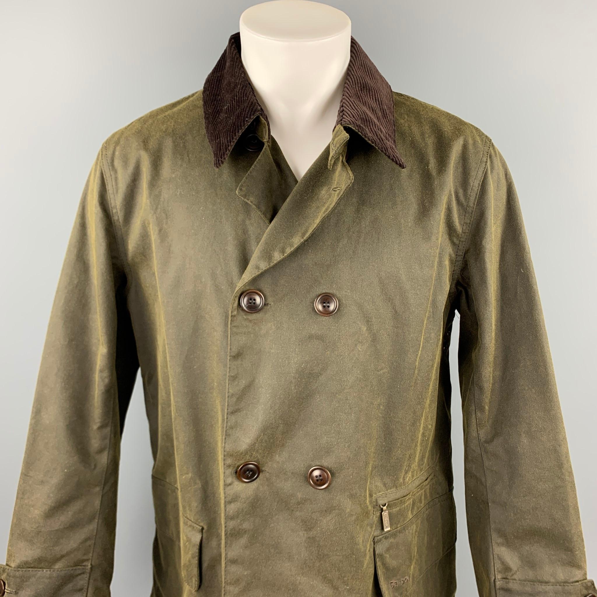 BARBOUR coat comes in a olive waxed cotton with a plaid liner featuring a corduroy collar, flap pockets, buttoned sleeves, and a double breasted closure. 

New With Tags. 
Marked: M

Measurements:

Shoulder: 19 in. 
Chest: 46 in. 
Sleeve: 25.5 in.