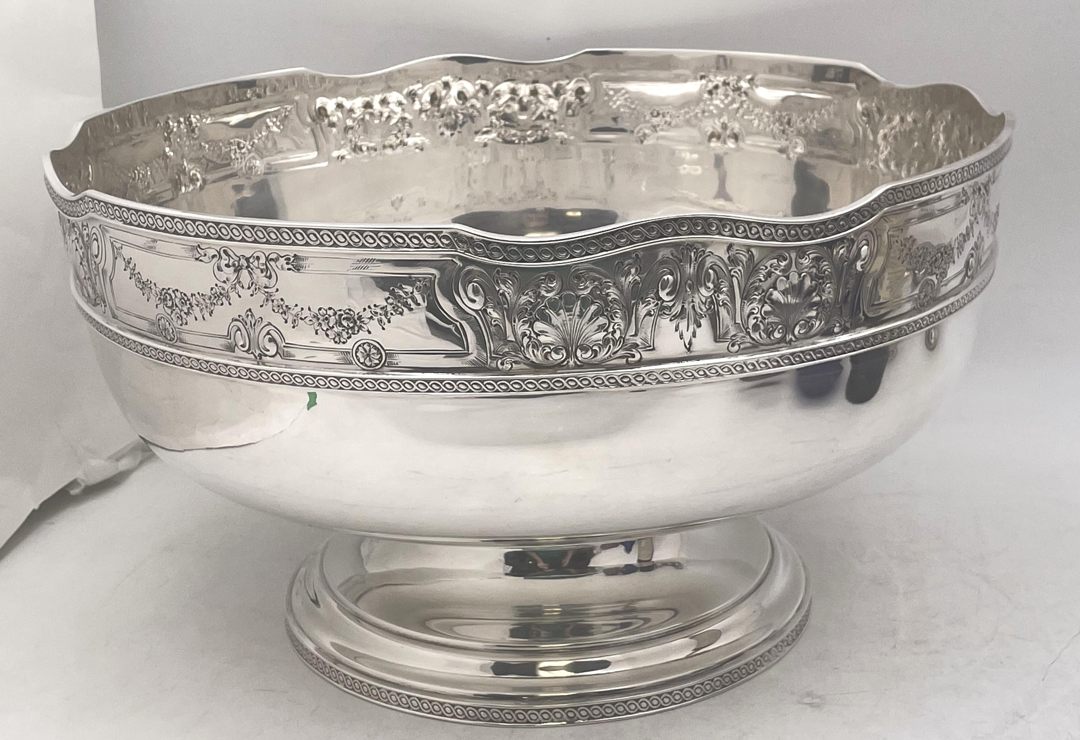 Barbour sterling silver impressive wine chiller or centerpiece punch bowl, beautifully adorned with shell and natural motifs, displaying geometric frieze-like motifs at the top and at the base. It measures 14'' in diameter by 8'' in height, weighs