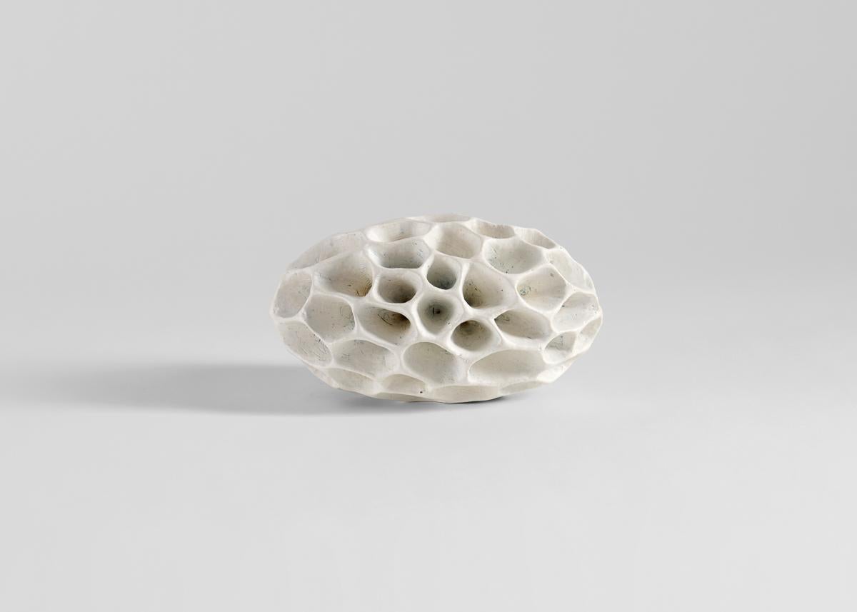 Åberg's works, made largely in black and white, are often purely sculptural,
even playfully non-utilitarian. Rough surfaces inspired by geology are set in
contrast to a refined elegance, new shapes inspired by fossils, old bones, or
coral, forms