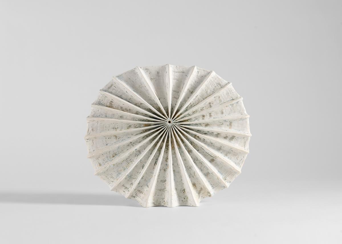 Åberg's works, made largely in black and white, are often purely sculptural,
even playfully non-utilitarian. Rough surfaces inspired by geology are set in
contrast to a refined elegance, new shapes inspired by fossils, old bones, or
coral, forms