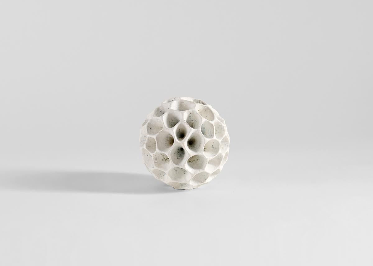 Åberg's works, made largely in black and white, are often purely sculptural,
even playfully non-utilitarian. Rough surfaces inspired by geology are set in
contrast to a refined elegance, new shapes inspired by fossils, old bones, or
coral, forms