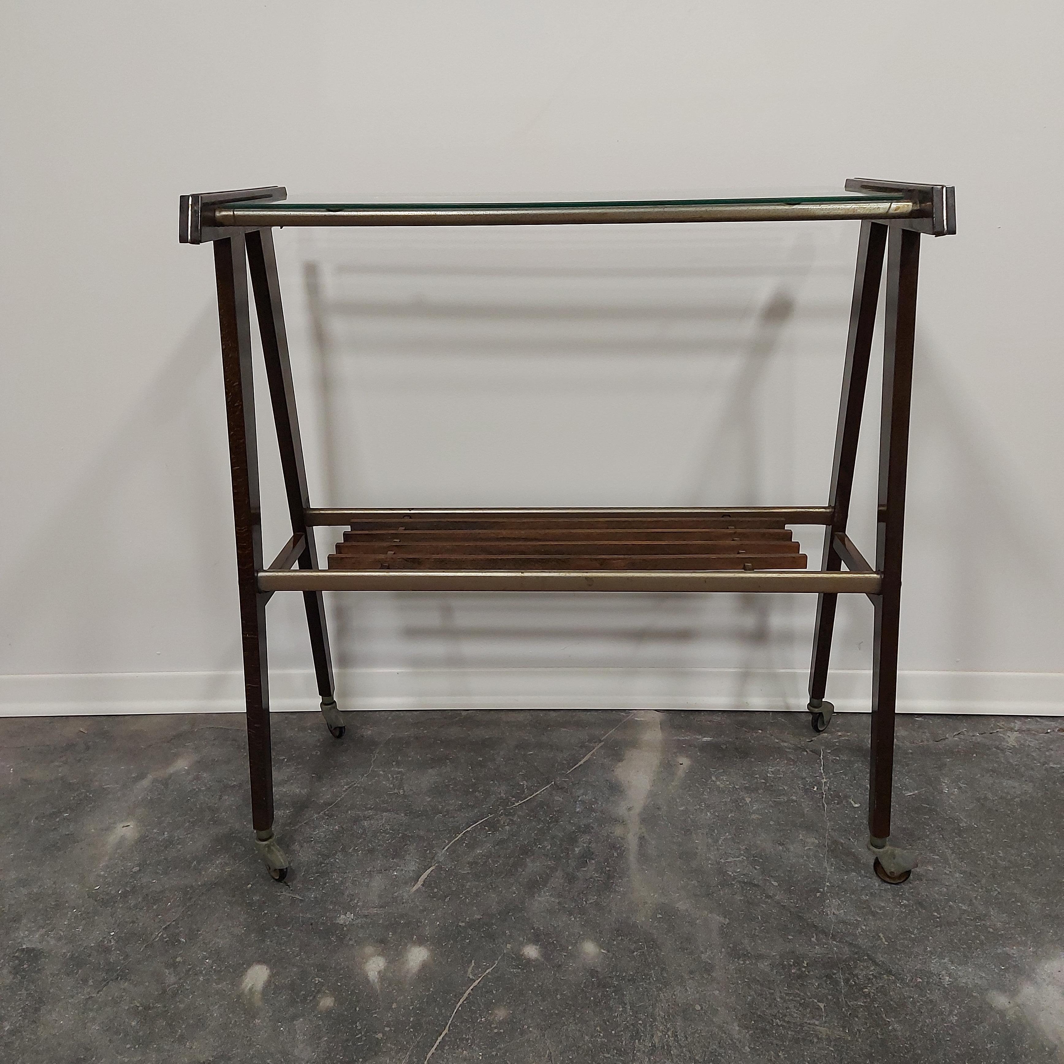 Barcart 1960s

Meterial: hardwood, glass, aluminium parts, chrome.

Beautiful patina.

H-82 cm (shelf - 40 cm)
W - 77,50 cm
D - 36 cm