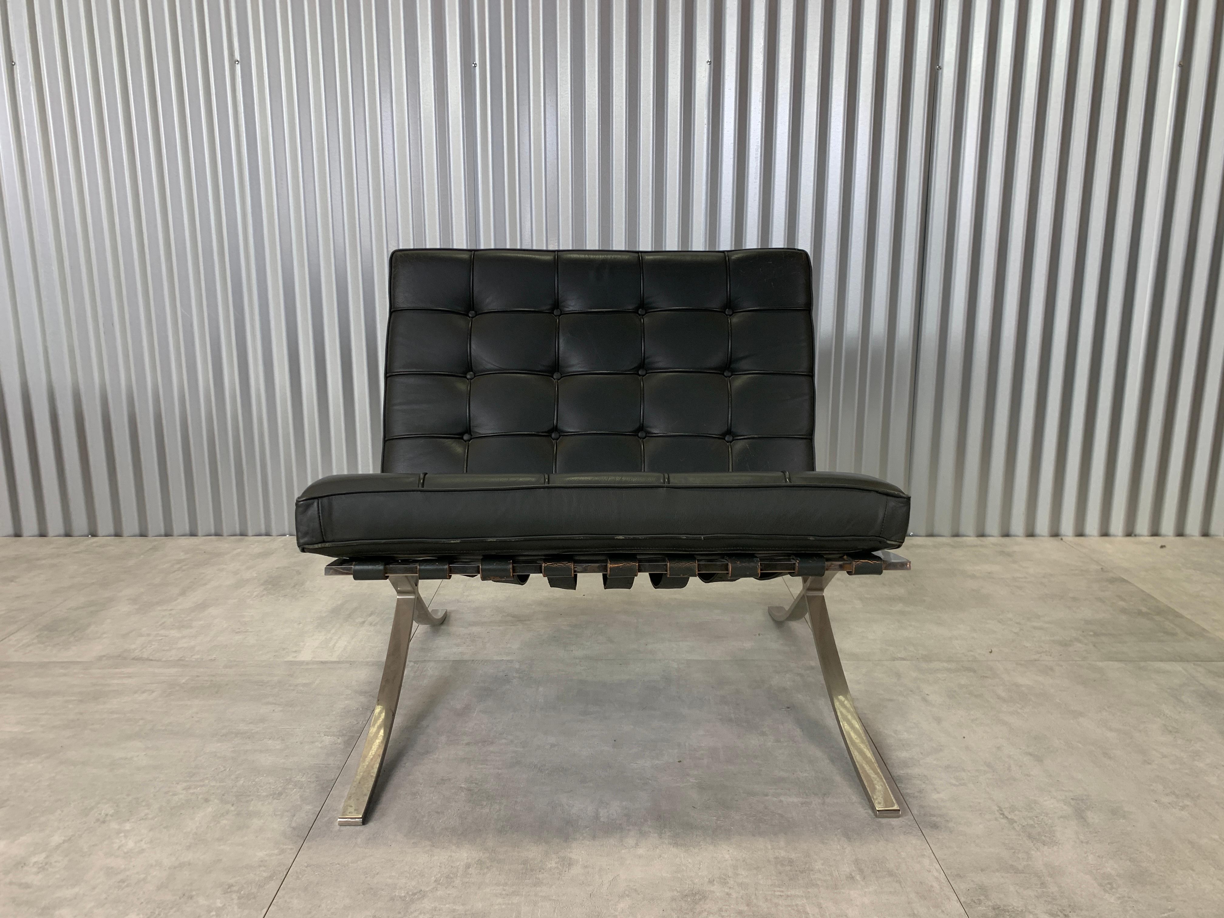 Rare set of four, early Barcelona chairs in elephant hide grey leather. Some patina and visible signs of age accentuate the domestically produced stainless steel construction. The supple grey leather and supportive and resilient foam indicate that