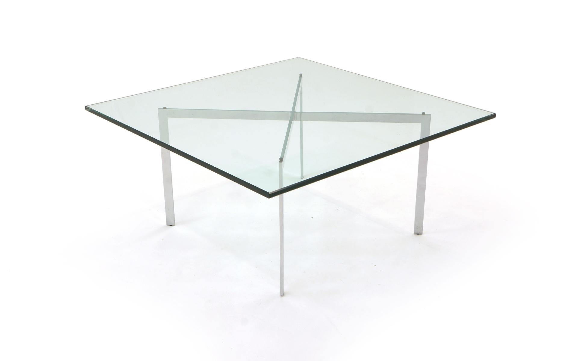 Barcelona style coffee table. No chips, or distracting scratches to the top. Looks close to new. Very high quality constructed chromed steel base and 1/2