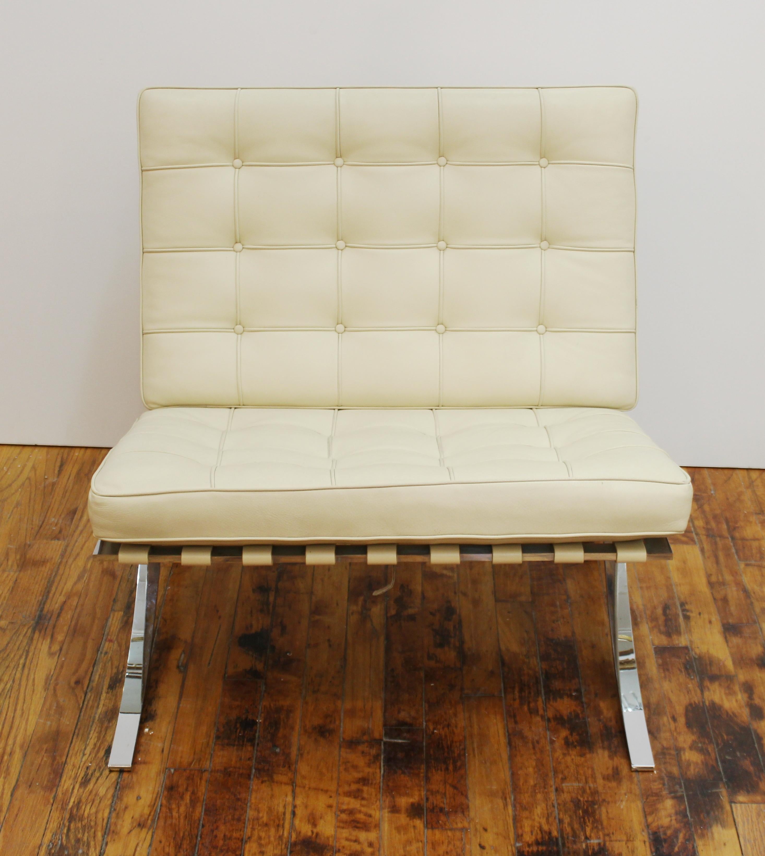 cream leather chair and ottoman