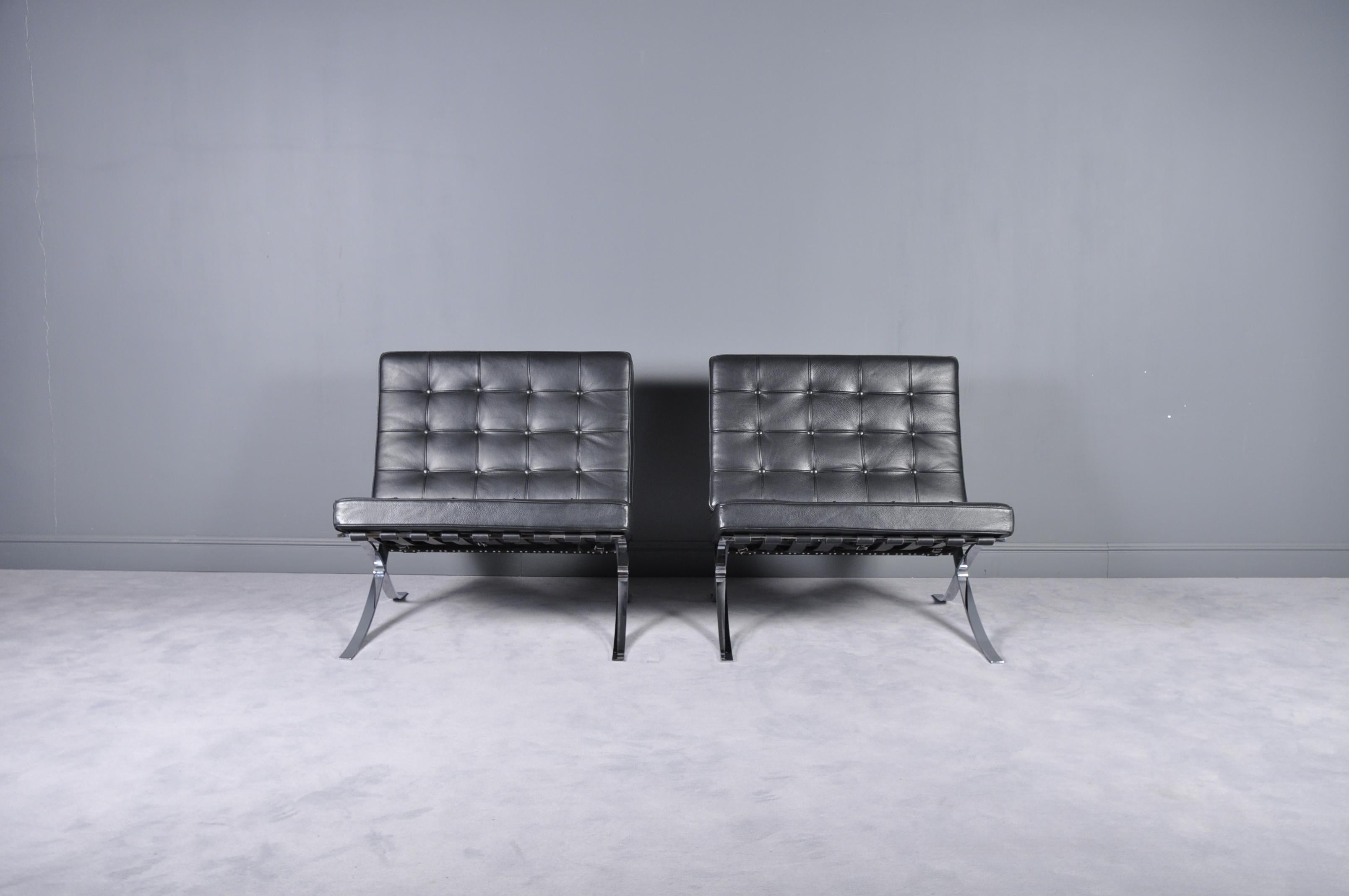 Set of two Barcelona lounge chairs by of Mies van der Rohe for Knoll Inc. Polished chrome structure, there are no markings or tags. They are high quality pair of chairs in excellent condition. Perfect for any midcentury or modern styled space.