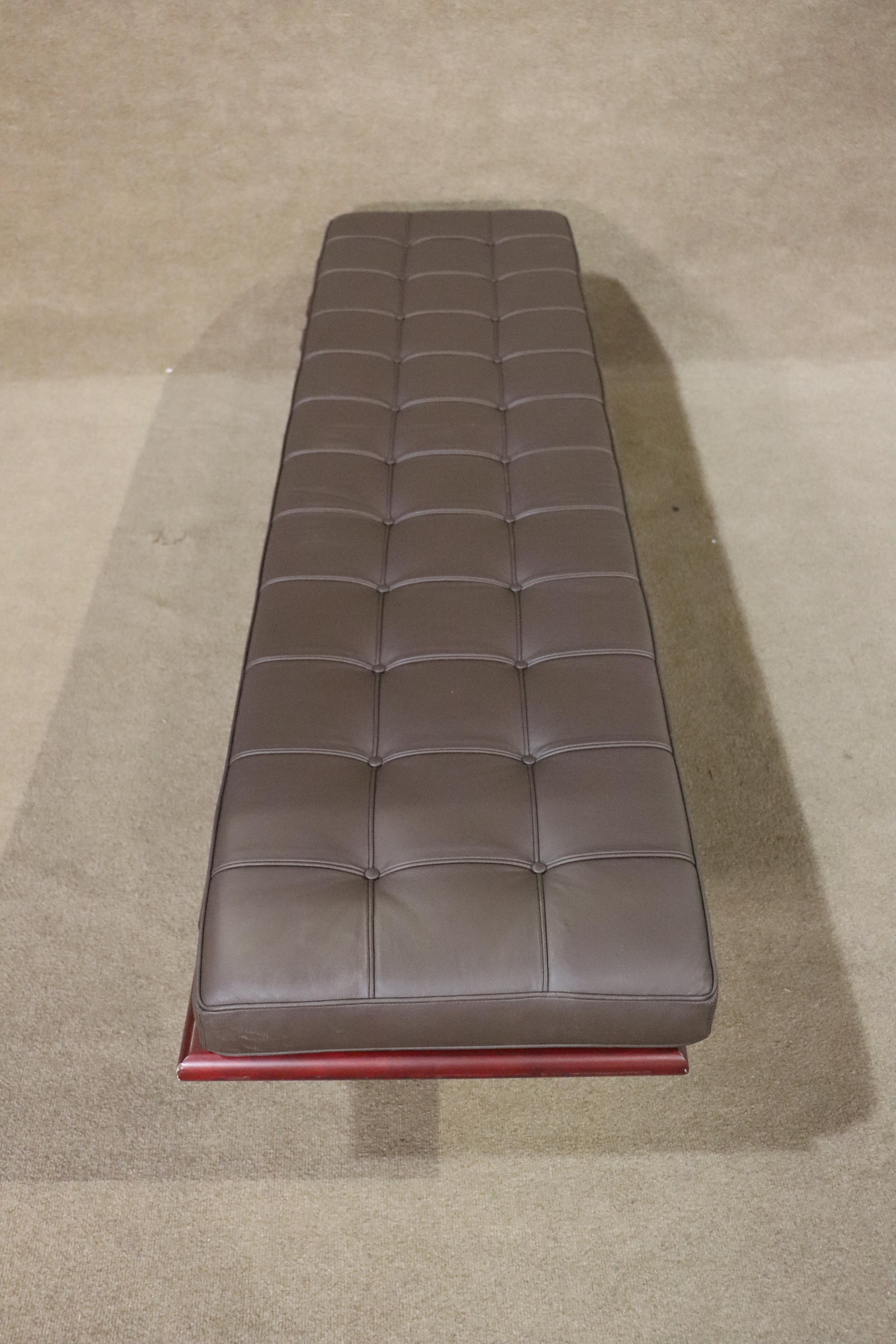 Six foot long tufted bench on polished chrome base. Designed in the style of Mies van der Rohe's Barcelona bench.
Please confirm location NY or NJ