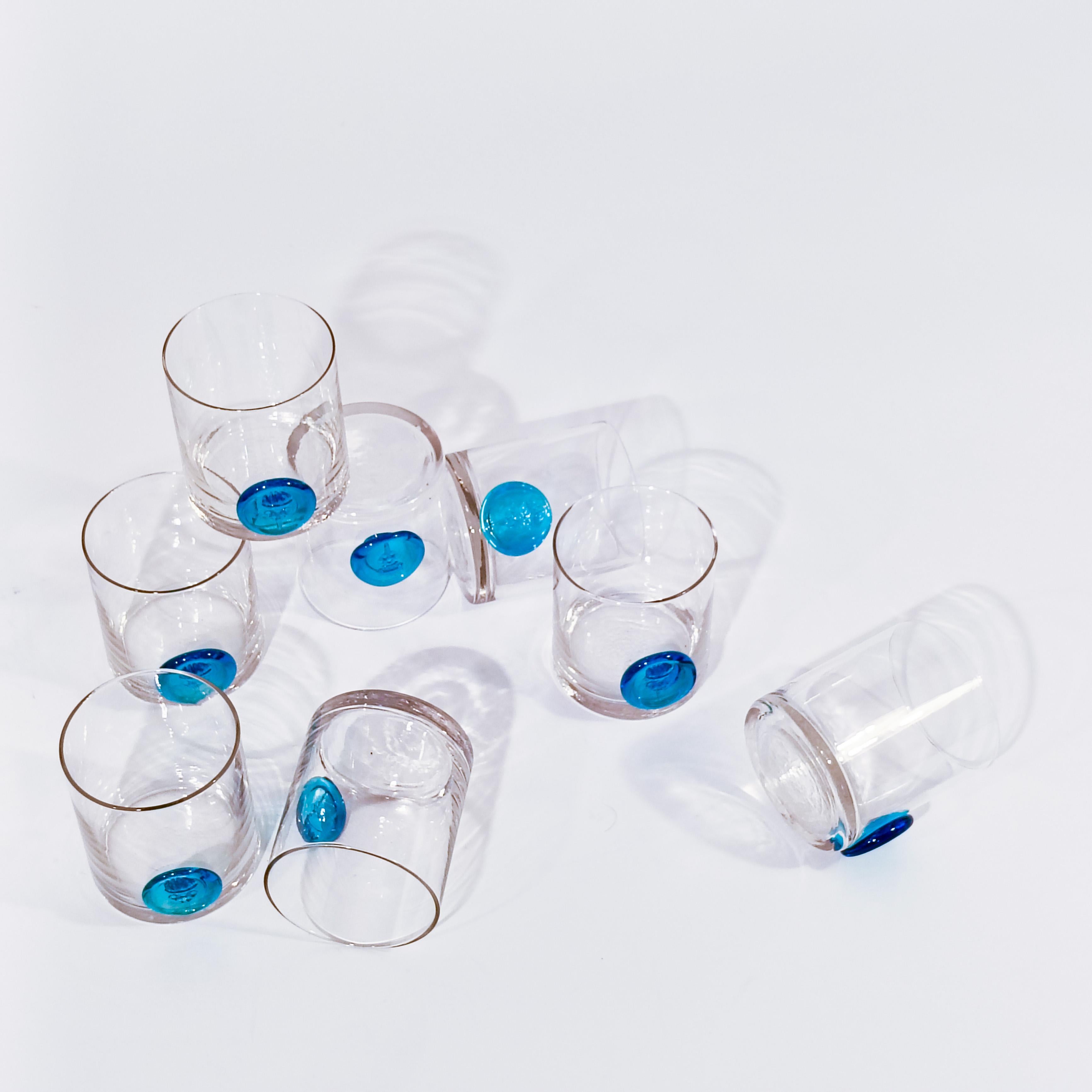 Hand-blown whiskey glasses from the Barcelona Olympic Games produced and manufactured by the glass artisans of Gordiola, 1992, set of 8. Made entirely by hand in transparent glass, with the stamp of the 1992 Barcelona Olympic Games in blue. Perfect