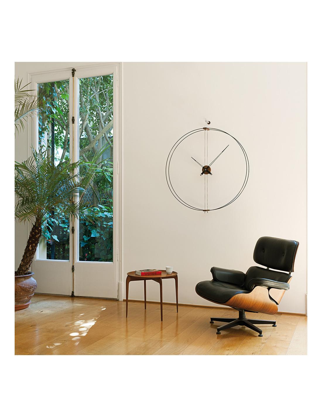 A beautiful piece for a modern home. The Barcelona Wall Clock is a simple and timeless piece that can easily be incorporated into any living space. Features an outstanding walnut wood material that is outlined by a beautiful black double fiberglass