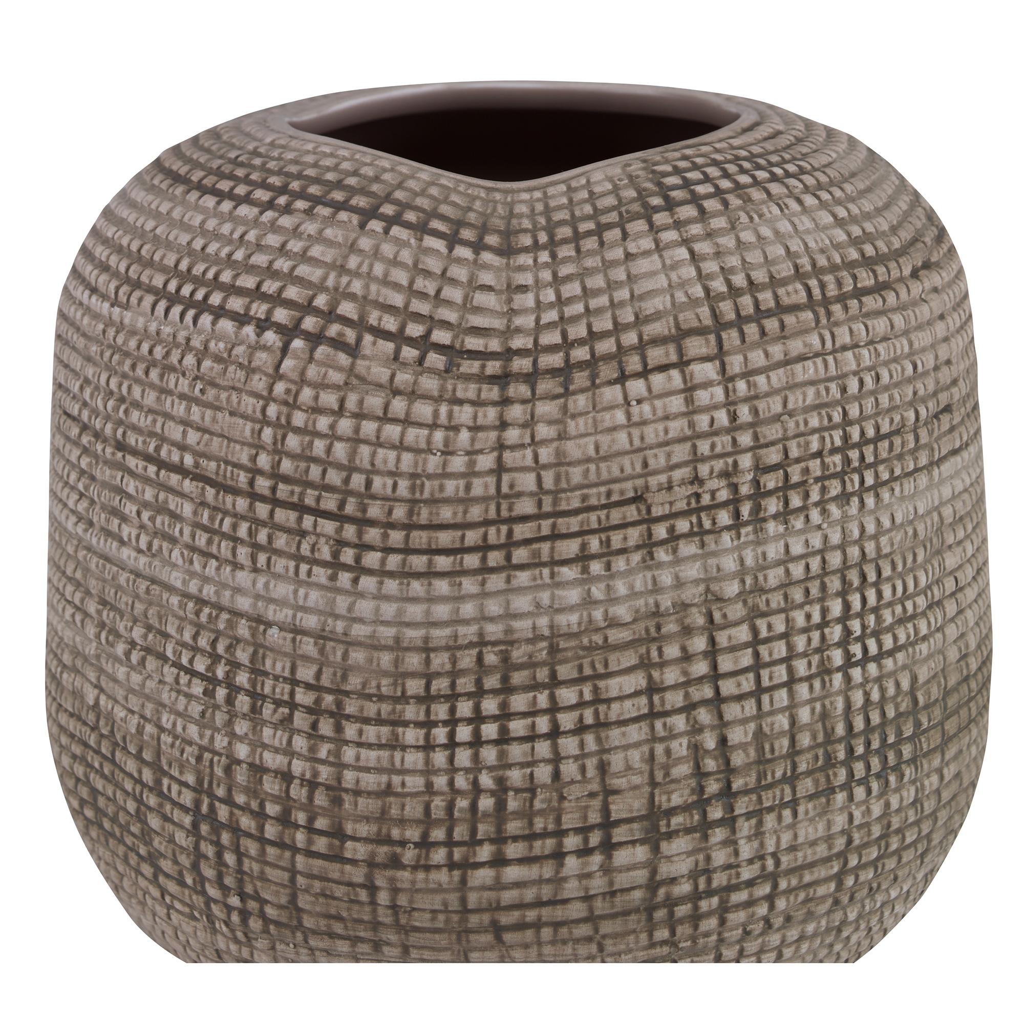 A small textured earthenware vase featuring a natural glaze. Due to the nature of the glaze, each vase is to be considered unique.
 