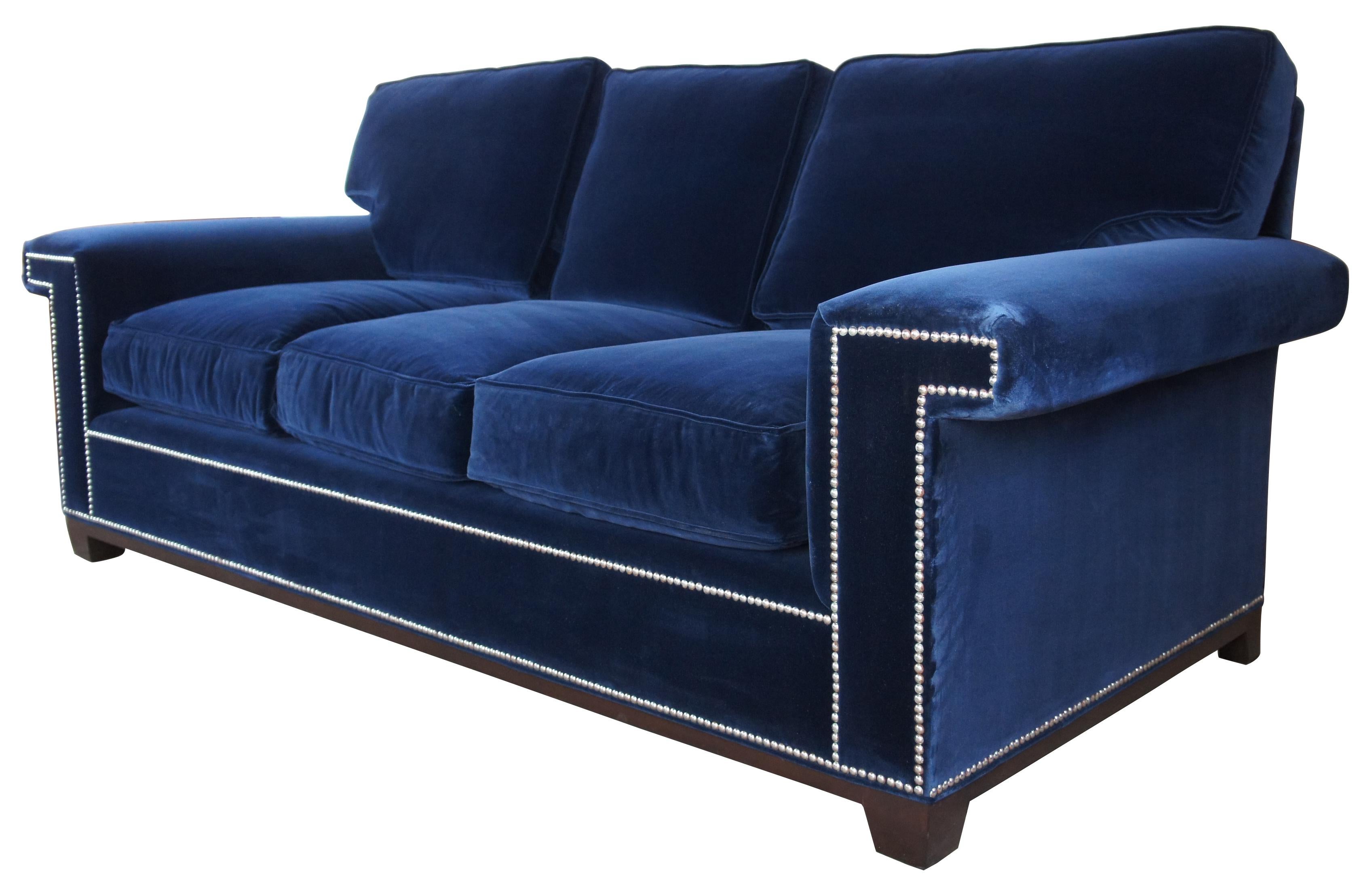 Barclay Butera interiors Paxton sofa modern blue velvet couch nailhead trim

Barclay Buteras Paxton sofa, upholstered in a blue velvet with silver nailhead trim over a bracketed base.