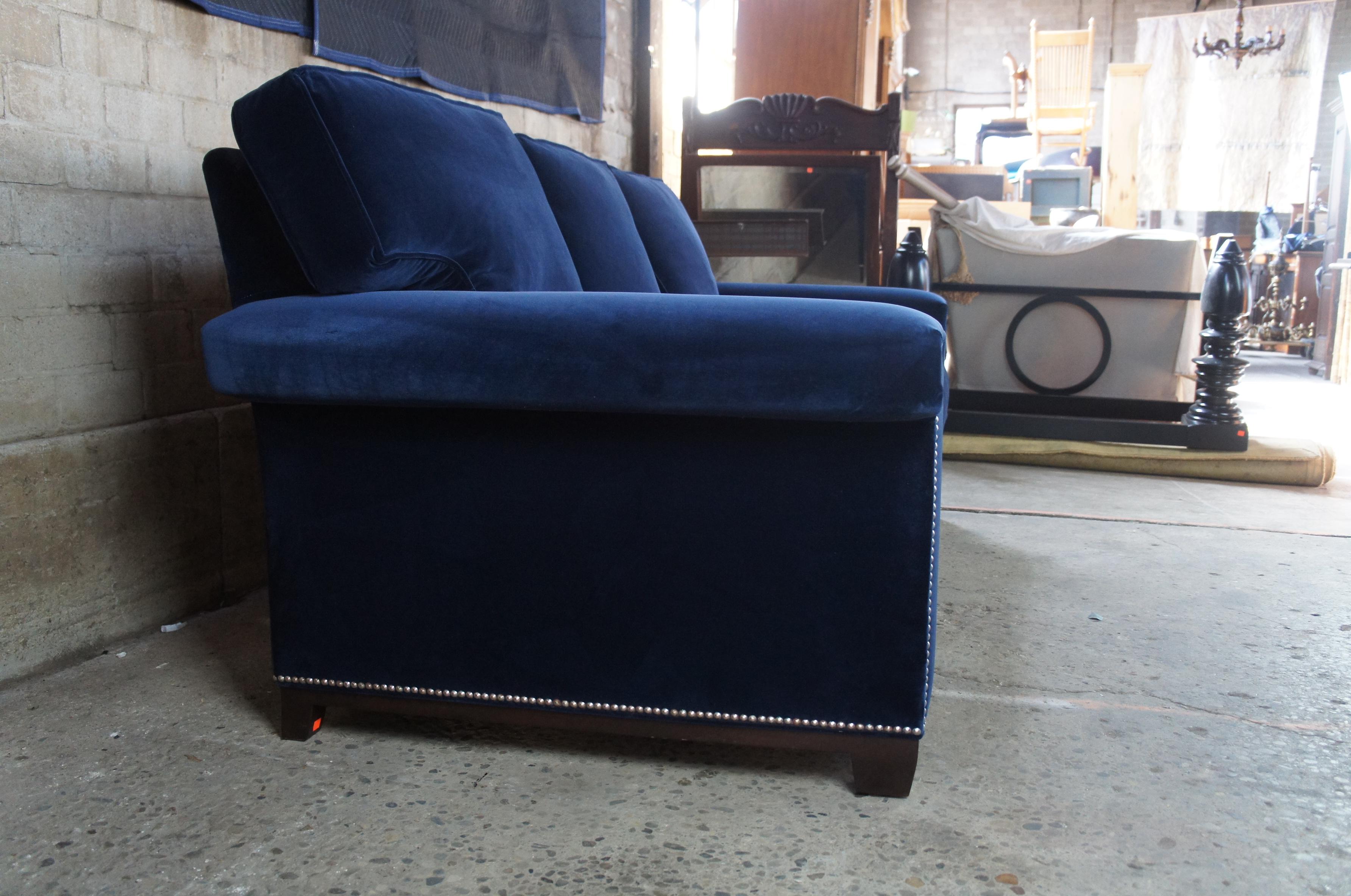 blue sofa with nailhead trim