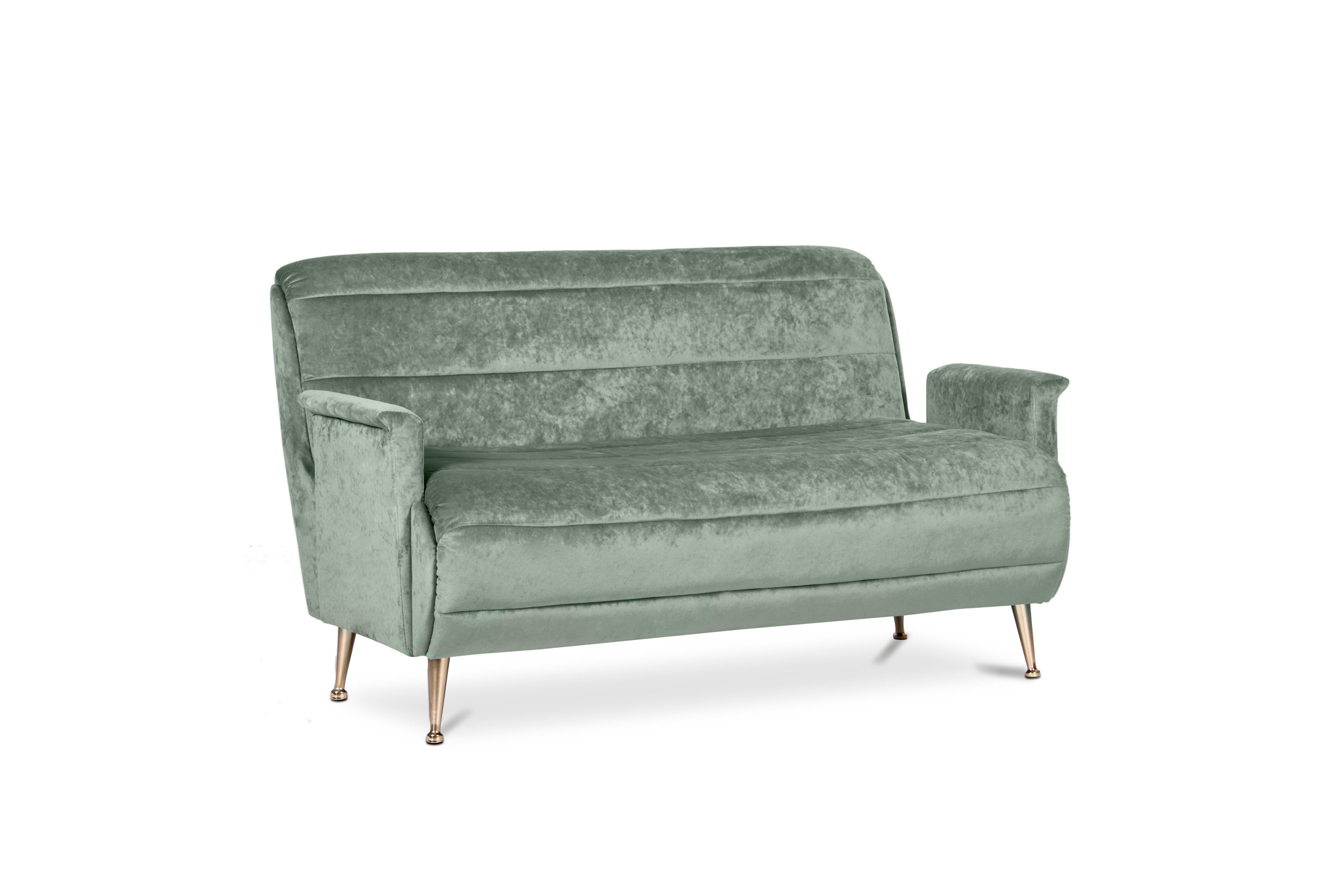 Bardot is truly a mid-century sofa that scales comfort, style and size. It comes with low arms and a horizontal tufting pattern that makes it quite distinctive. It has a single bench line cushion and tapered legs in polished brass, that create a