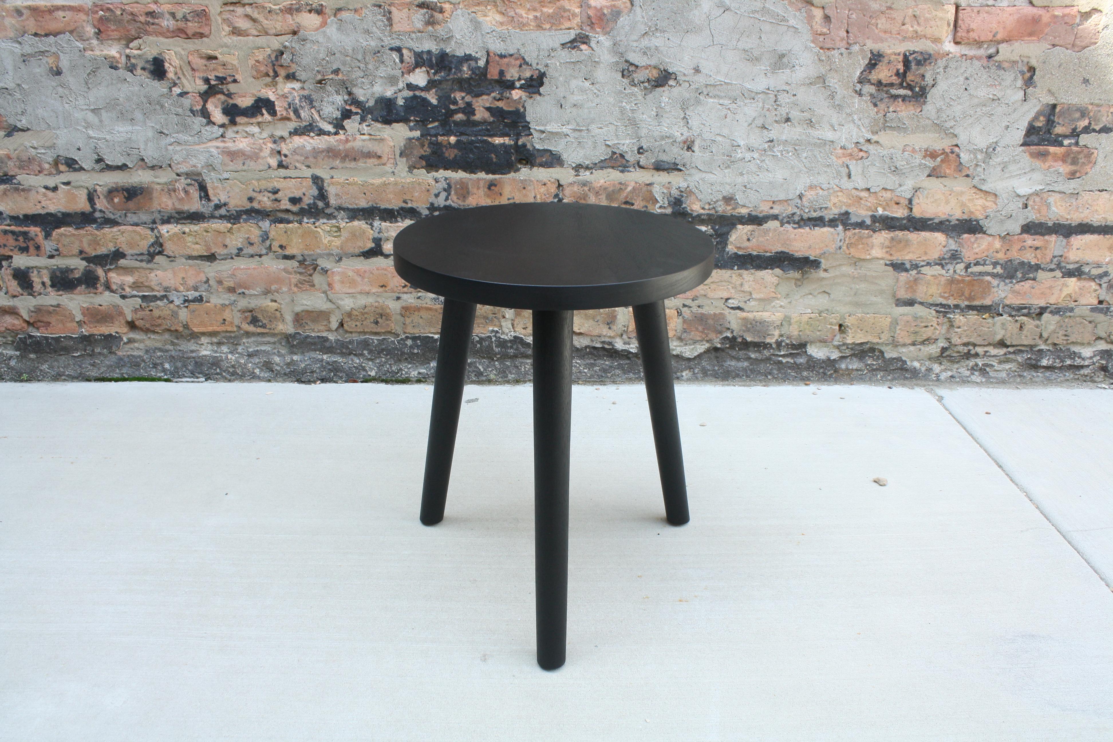 Shown in ebonized walnut and natural cherry

This solid wood side table features hand-turned, tapered legs joined to a simple, under-beveled round top with wedged through tenon joinery. Simplicity in design and construction emphasizes wood grain and