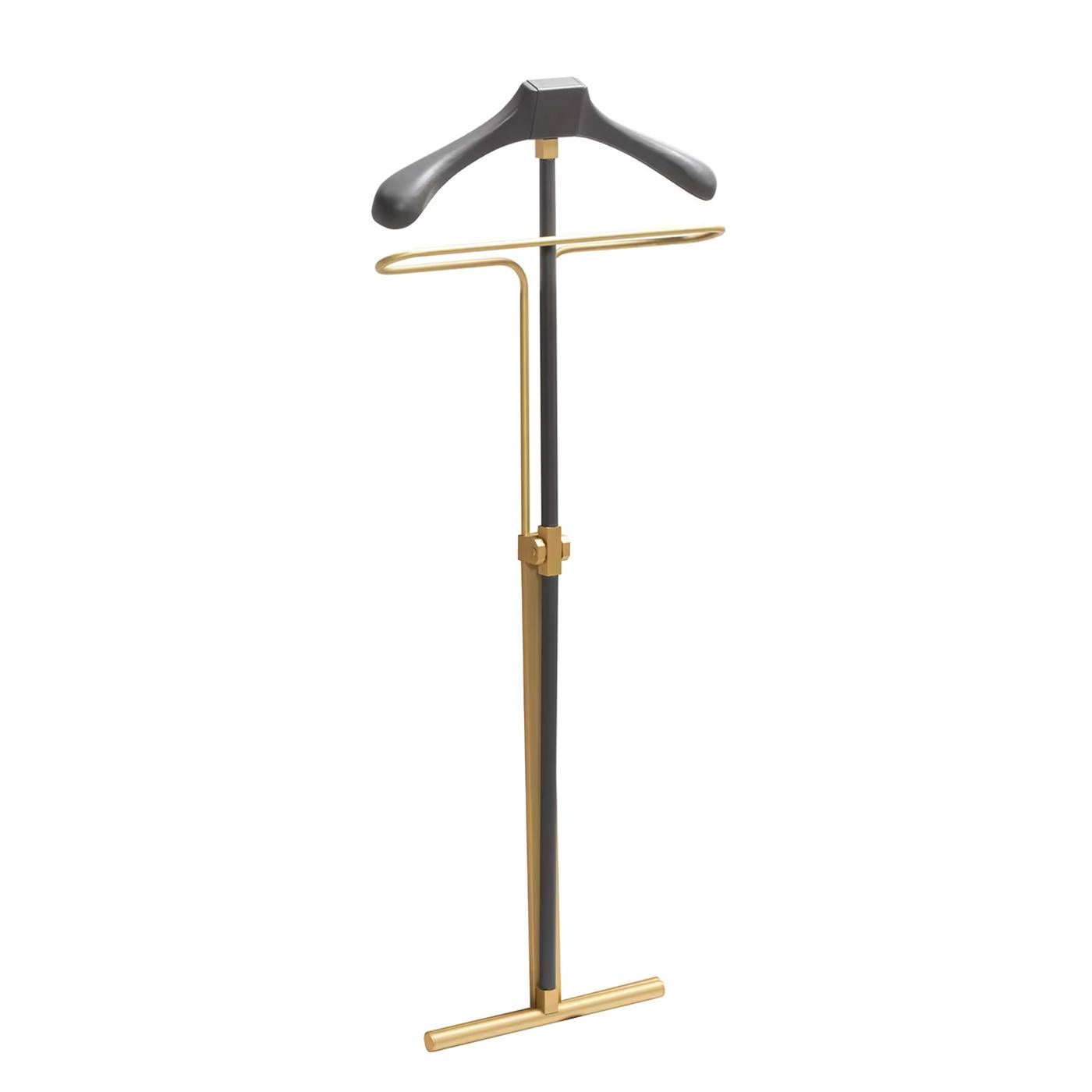 Valet Barell Folding with structure in solid brass in matte finish
and in bronzed finish, coatrack covered with italian genuine leather 
in sober grey color.
Also available with structure in solid brass in chrome finish and covered 
with italian