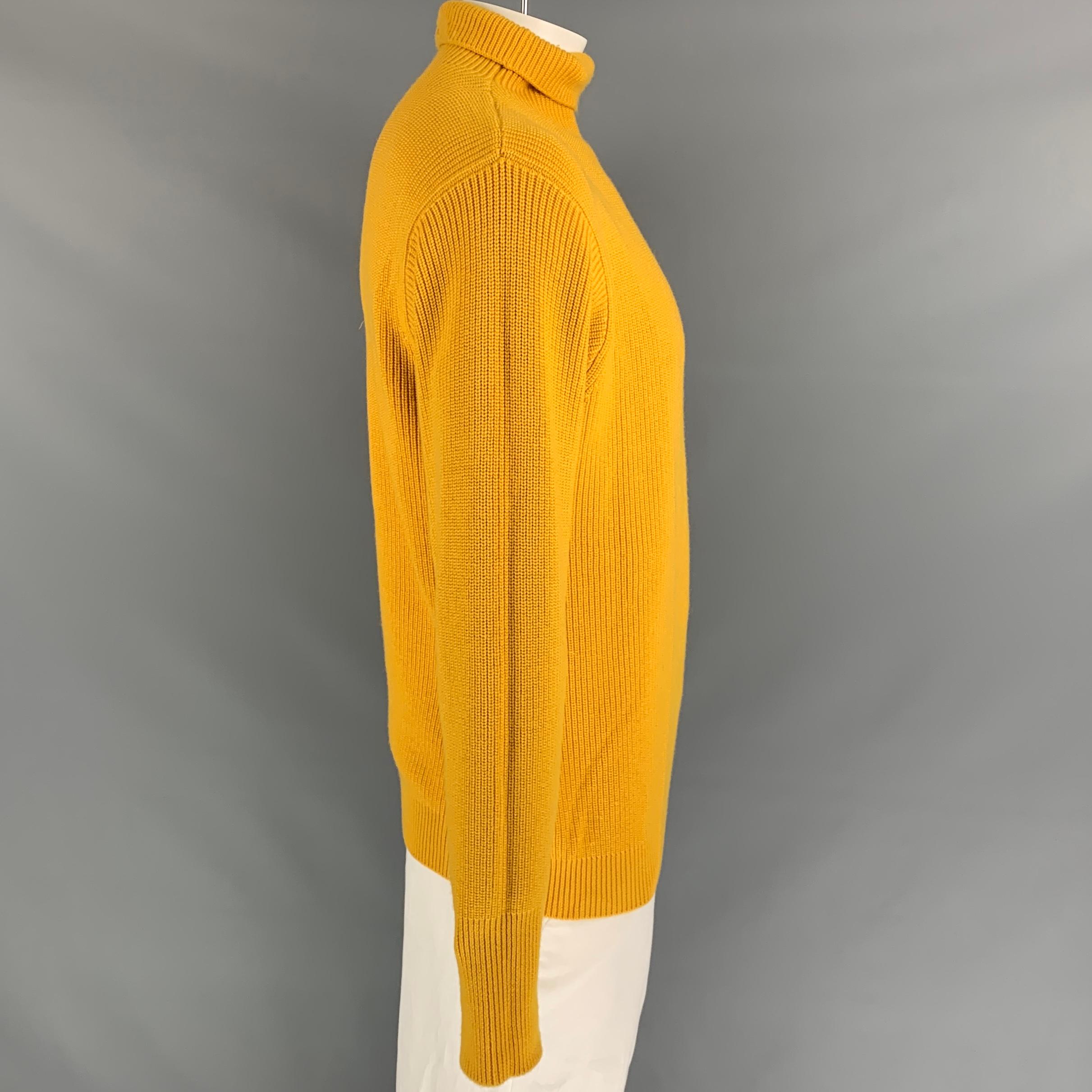 BARENA sweater comes in a yellow knitted wool featuring a long sleeves, thumb holes, and a turtleneck. Made in Italy.

Very Good Pre-Owned Condition.
Marked: XXL

Measurements:

Shoulder: 21 in.
Chest: 44 in.
Sleeve: 27 in.
Length: 28 in. 