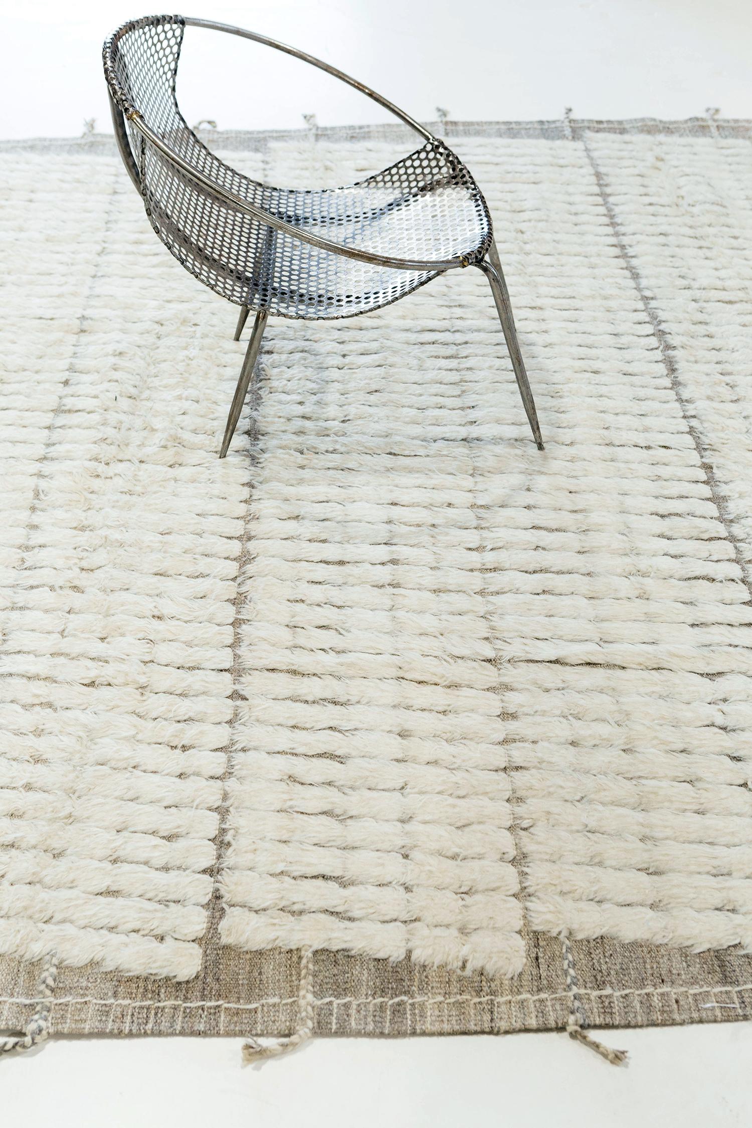 The signature Collection of California. Handwoven luxurious wool rug, made of timeless design elements and neutral earth tones with the perfect shade of ivory. Haute Bohemian Collection: designed in Los Angeles named for the winds knitting together