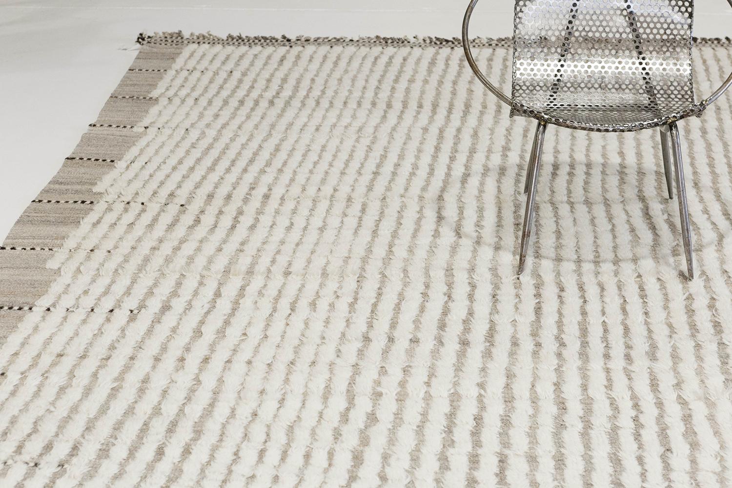 The signature Collection of California. Handwoven luxurious wool rug, made of timeless design elements and neutral earth tones with the perfect shade of white shag. Haute Bohemian collection: designed in Los Angeles named for the winds knitting