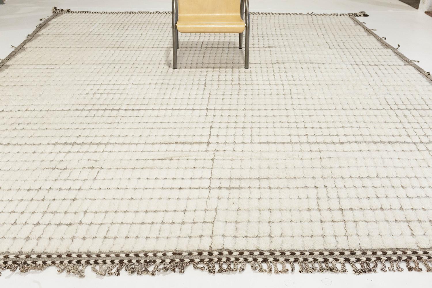 The signature Collection of California. Handwoven luxurious wool rug, made of timeless design elements and neutral earth tones with the perfect shade of dove white shag. Haute Bohemian collection: designed in Los Angeles named for the winds knitting