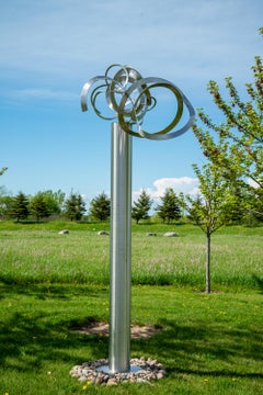 Just Breath - tall, dynamic, abstract polished stainless steel outdoor sculpture