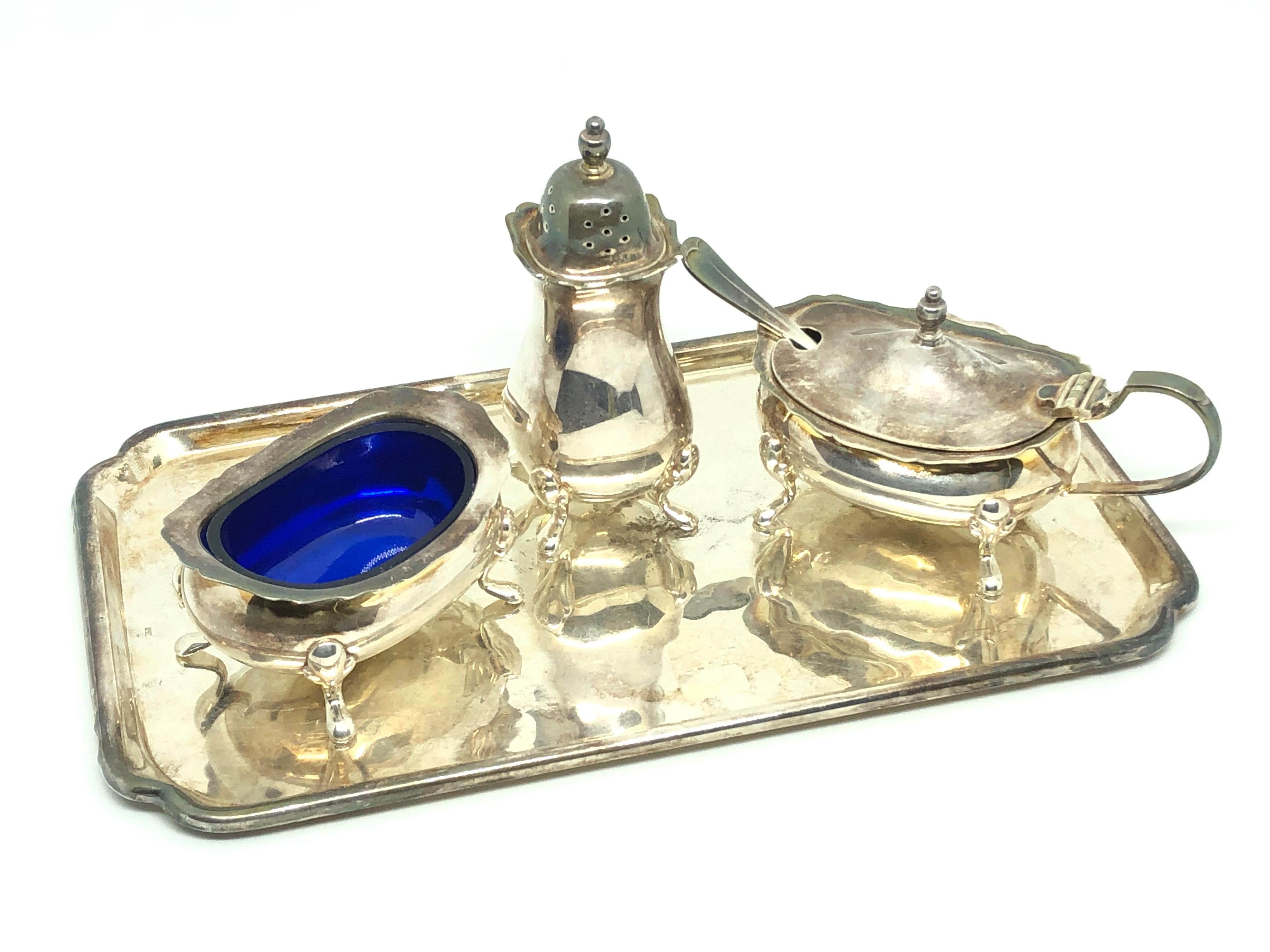 Gorgeous silver plated set of open salt and Pepper Shaker with a Mustard pot on a tray. A beautiful decorative item. Found on a estate sale in Malmo, Sweden. Made by Barker Ellis in England. A nice addition to any table.