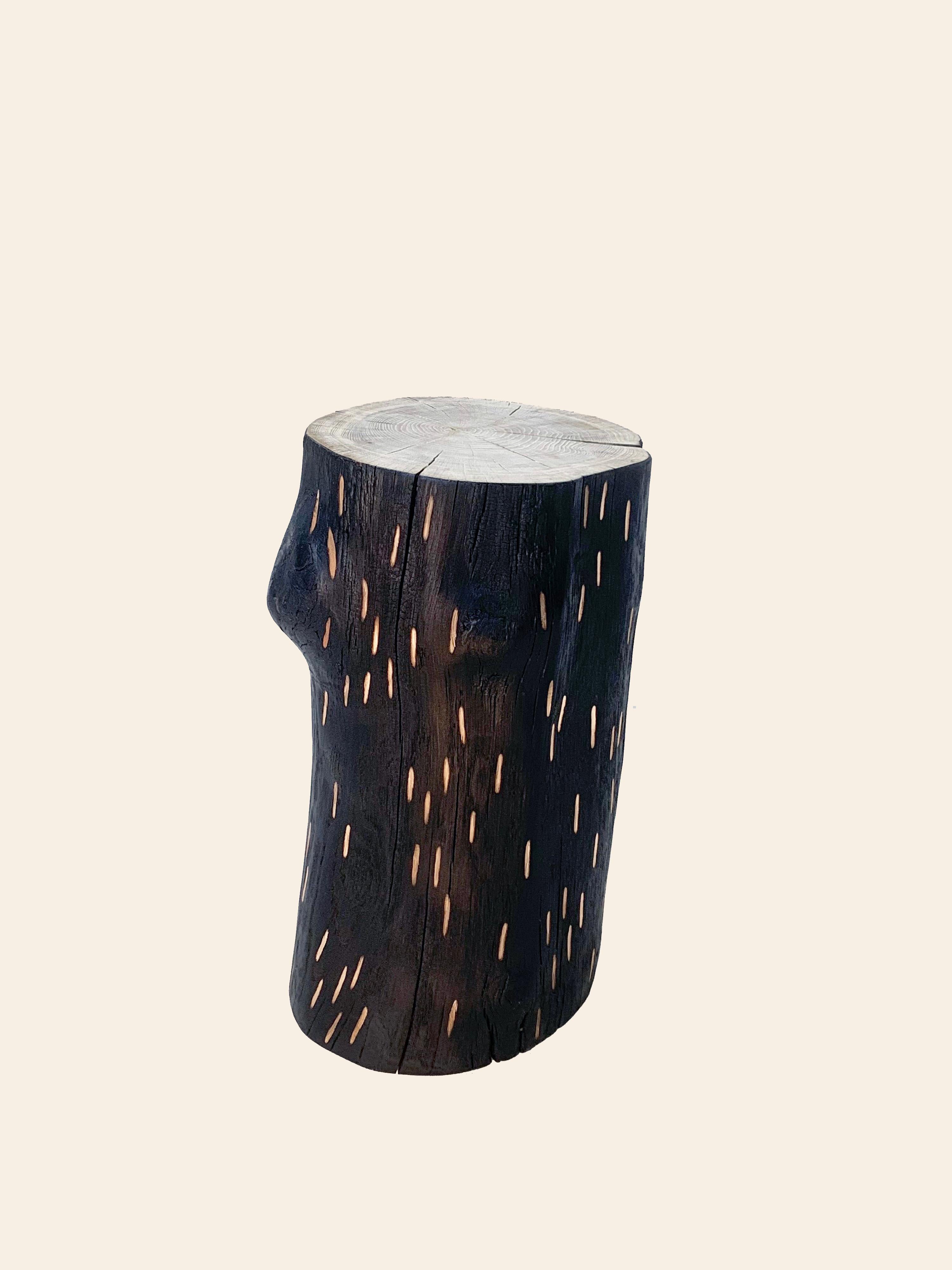 British 'Barking Up The Wrong Log' charred oak stool with hand carved markings