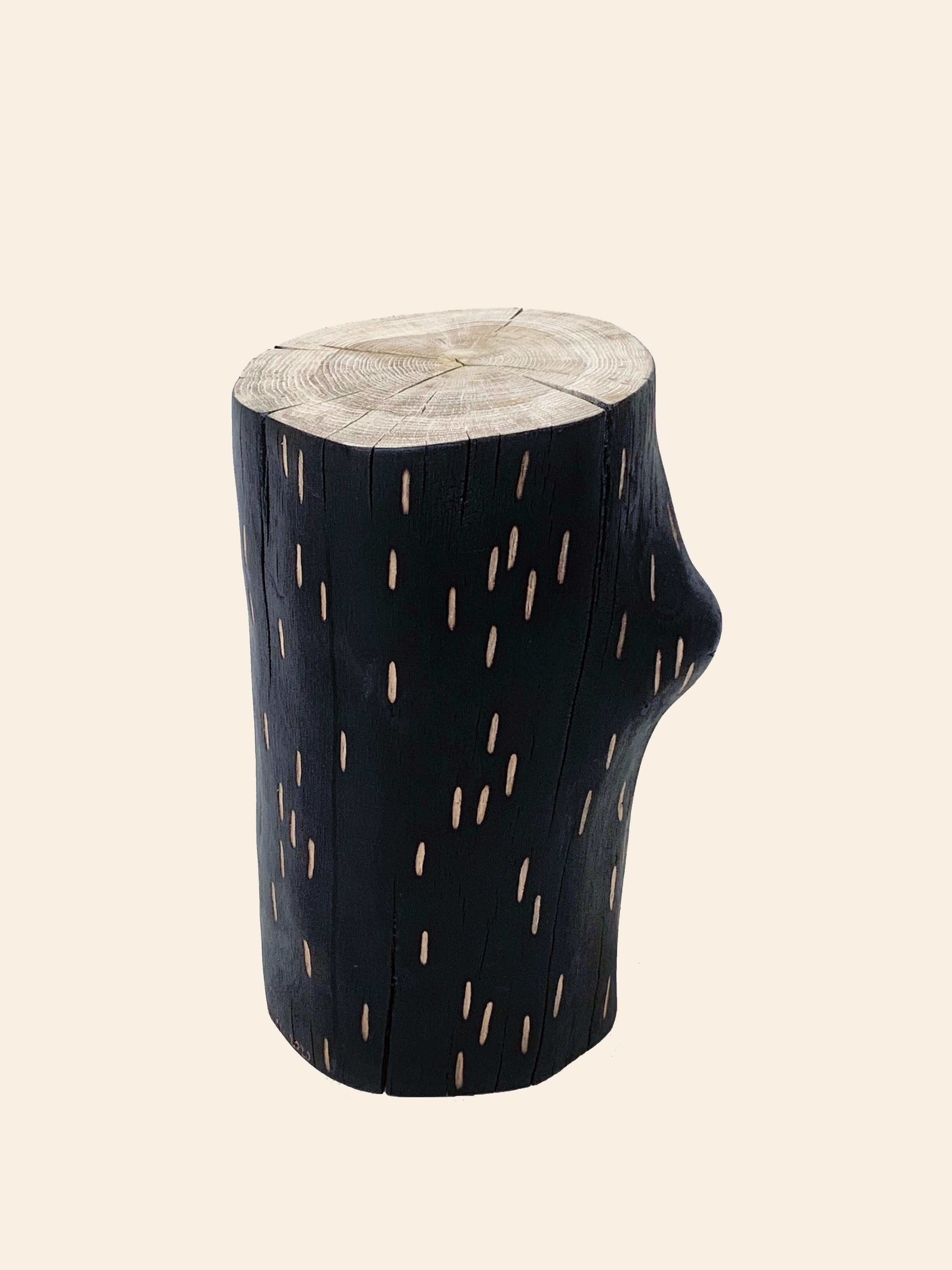 The notched markings found on the bark of a birch tree have been borrowed to make a new coat for this collection, which can be used as a small table or a stool.
We hand pick each individual log section for it’s character. The surface is blackened