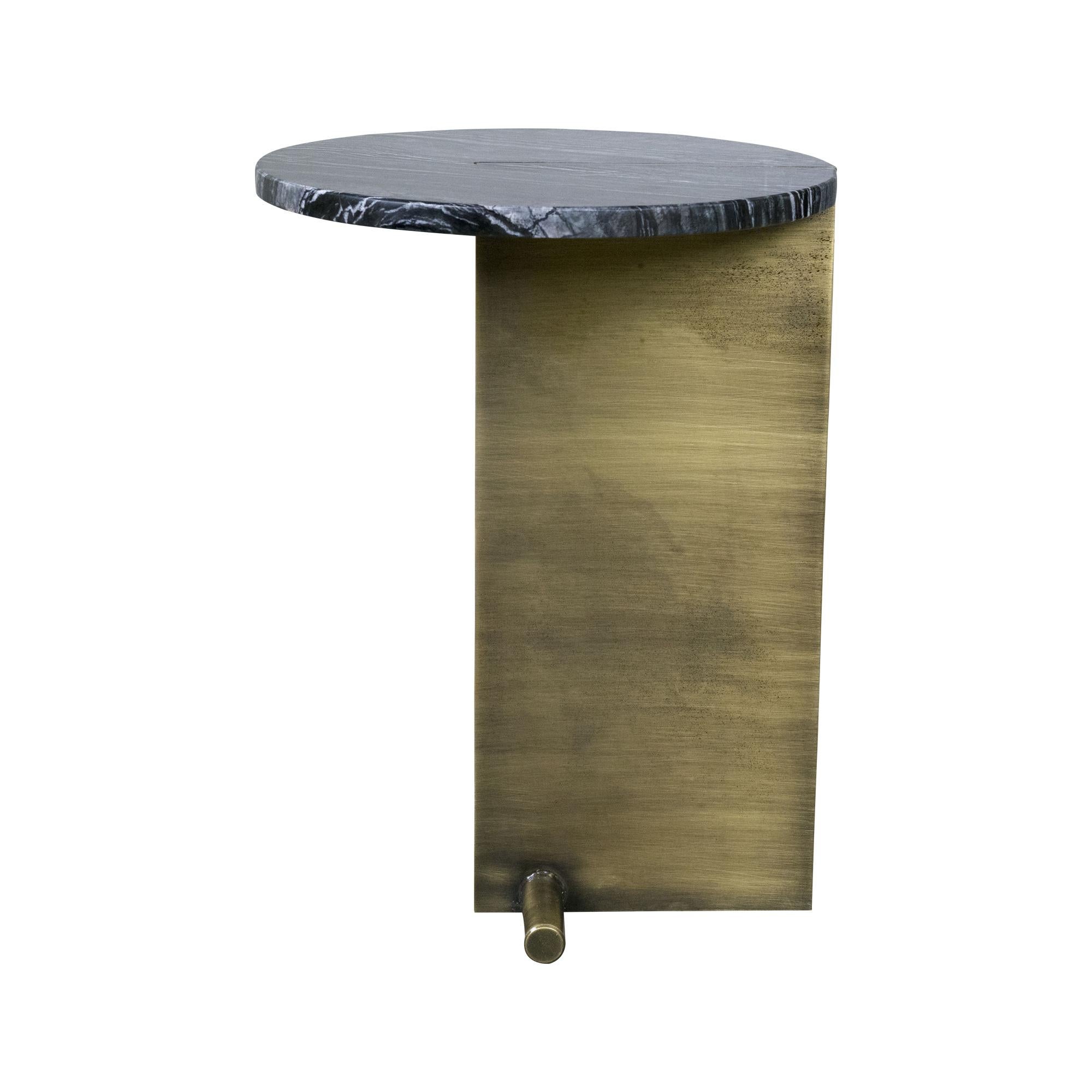 Side table with a round marble top mounted on a modern brass leg. 
Marble: black, green or white
Can be customized.