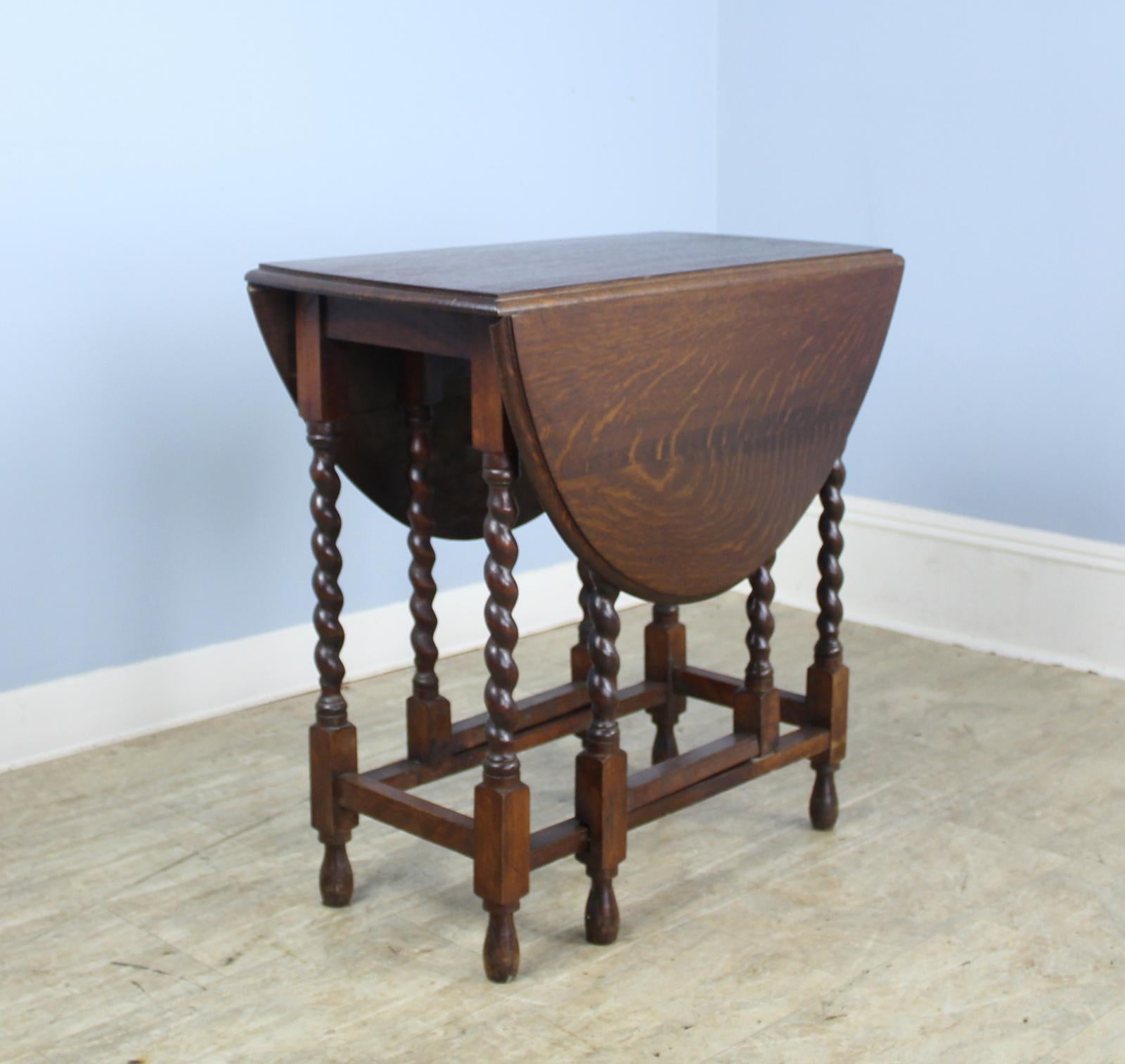 This is an excellent example of the classic. It is a smaller size, suitable as a small breakfast table, fine for a tea table. Good dark color and nice patina; turnings are eye catching. It is appropriate as a side, lamp or end table. Additionally,
