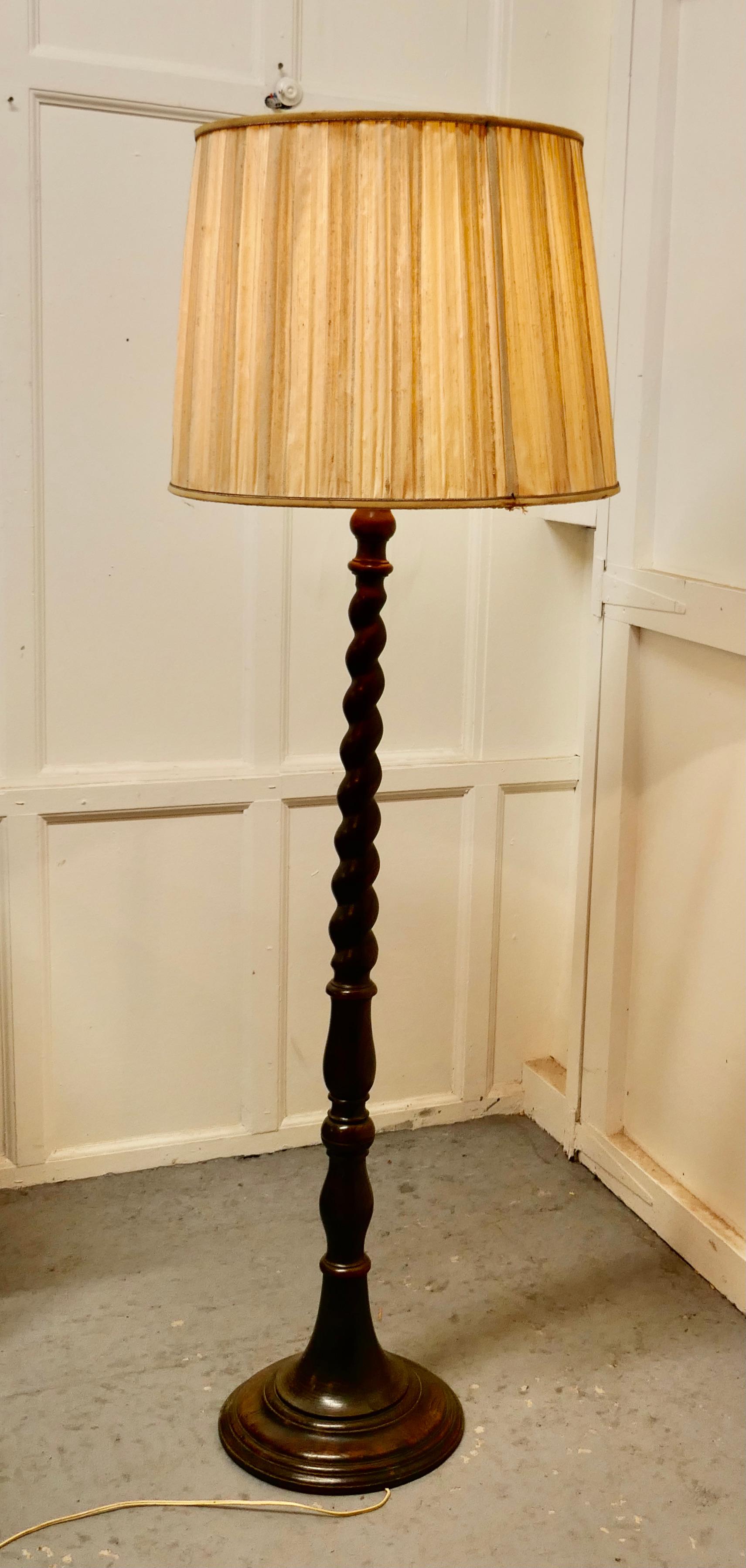 Barley twist floor standing standard oak lamp

 A skilfully turned piece, this lamp stands on a turned wooden base, it is in good condition, the wiring seems to be new but should be checked over when installed
The lamp is 67” high and the base is