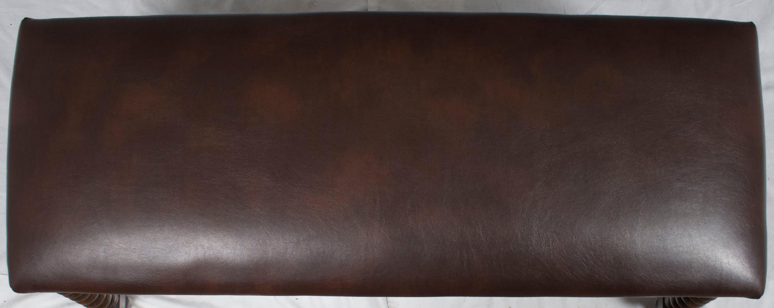 Newly made, this leather top bench exudes elegant style and heirloom quality. The top consists of a dark brown leather. This genuine, semi-aniline dyed leather is supple and provides an excellent sitting experience.
Sturdily supported the leather