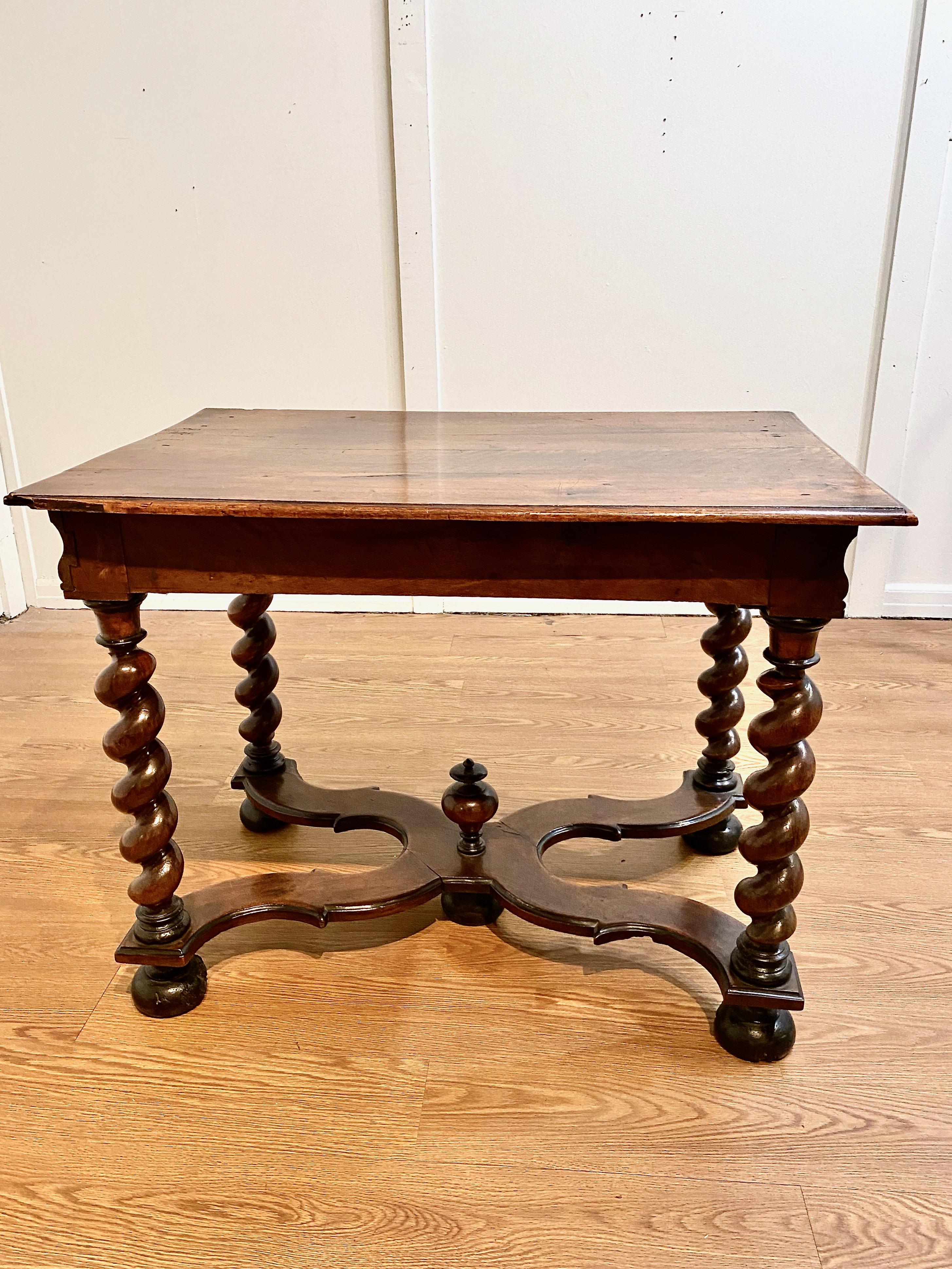 This is a superb example of a late 17th century Franco-Flemish period Louis XIV side table or writing table. The table is in original condition with an old multi-layer waxed surface. The two board walnut top is supported by beefy, but elegant and