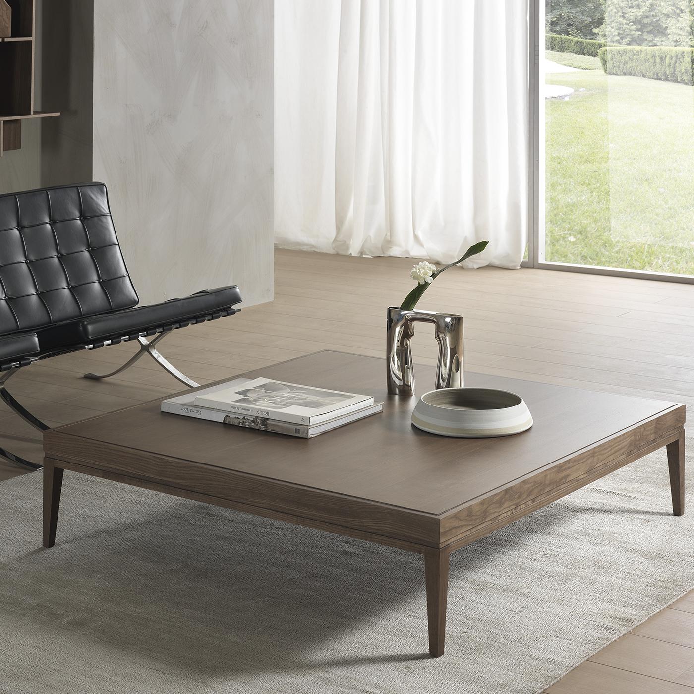 Elegant and Minimalist, this refined coffee table was designed by architect Fabio Rebosio and is also available in a rectangular version with a wooden or glass top. In this version, the square silhouette of the piece is entirely crafted of ash with